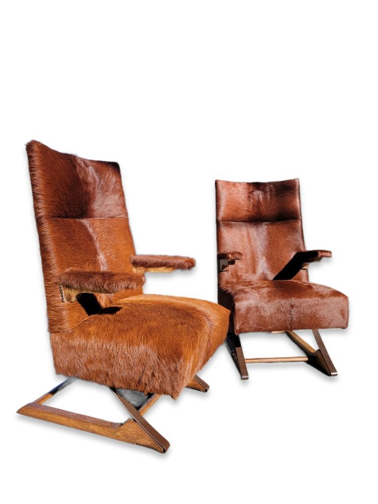 Mid-Century Modern cantilever rockers newly upholstered in a Brazilian cowhide - pair
Exquisite pair of vintage Mid-Century Modern cantilever spring rockers. Unique, stylish and rustic, fully custom restored and upholstered in a gorgeous Brazilian
