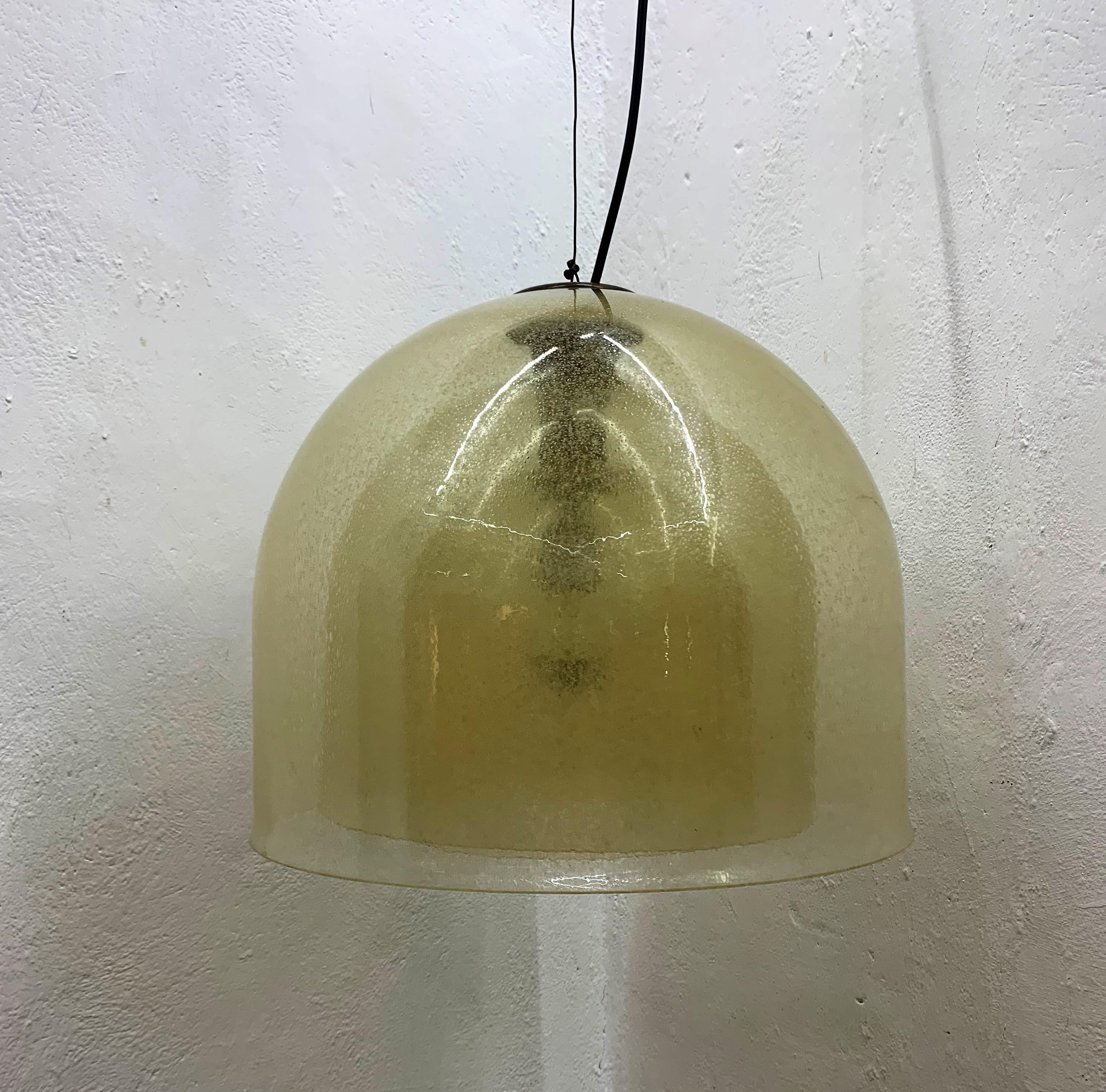Beautiful and rare Mid-Century Modern chandelier pendant lamp manufactured by Mazzega, designed by Carlo Nason, circa 1960s, Murano, Italy.
This chandelier consists of 3 bell shaped pieces stacked together in an amber gold Murano glass executed in