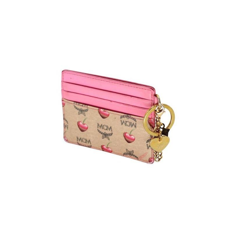 MCM Cherry Monogram Coin Pouch Keychain Wallet MC-1202P-0004

This cute and sophisticated small Mcm Cherry monogram travel coin pouch features a durable leather and gold-tone hardware keychain. It will hold all your on-the-go credit cards and more.