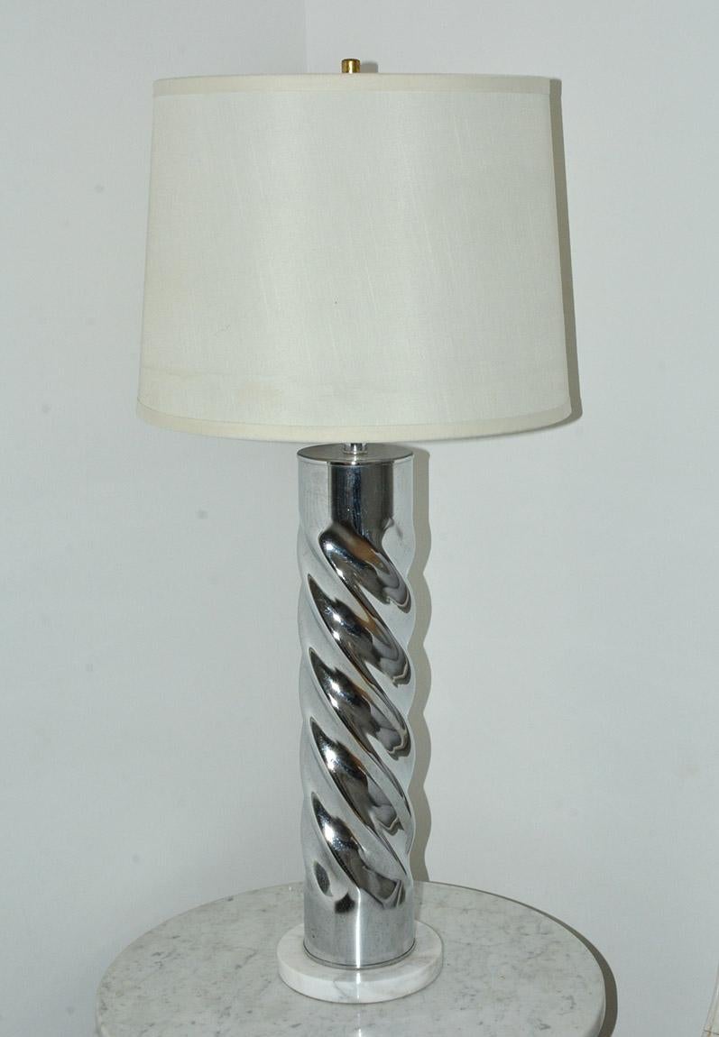 Highly stylish contemporary chrome table lamp with marble base. Elegance and style, the lamp lends itself to be used in many decor. 
Height with shade - 32.63