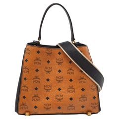 MCM Fourre-tout Corina en cuir et toile enduite Visetos cognac/noir