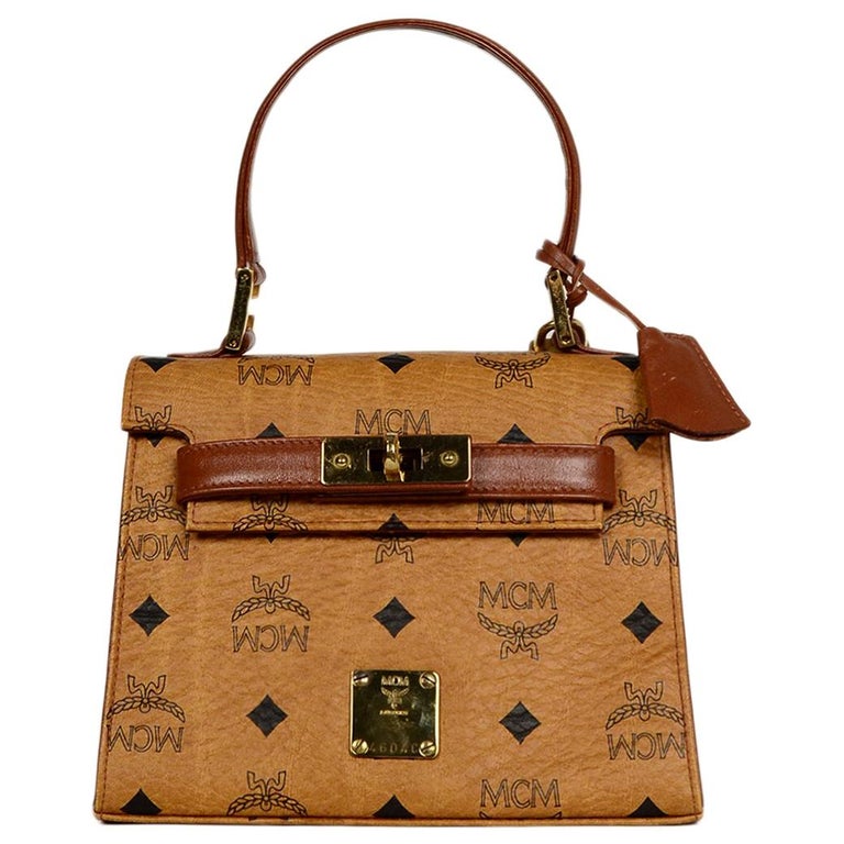 Authentic MCM Cognac Visetos Flap Pocket Top Handle bag with bag