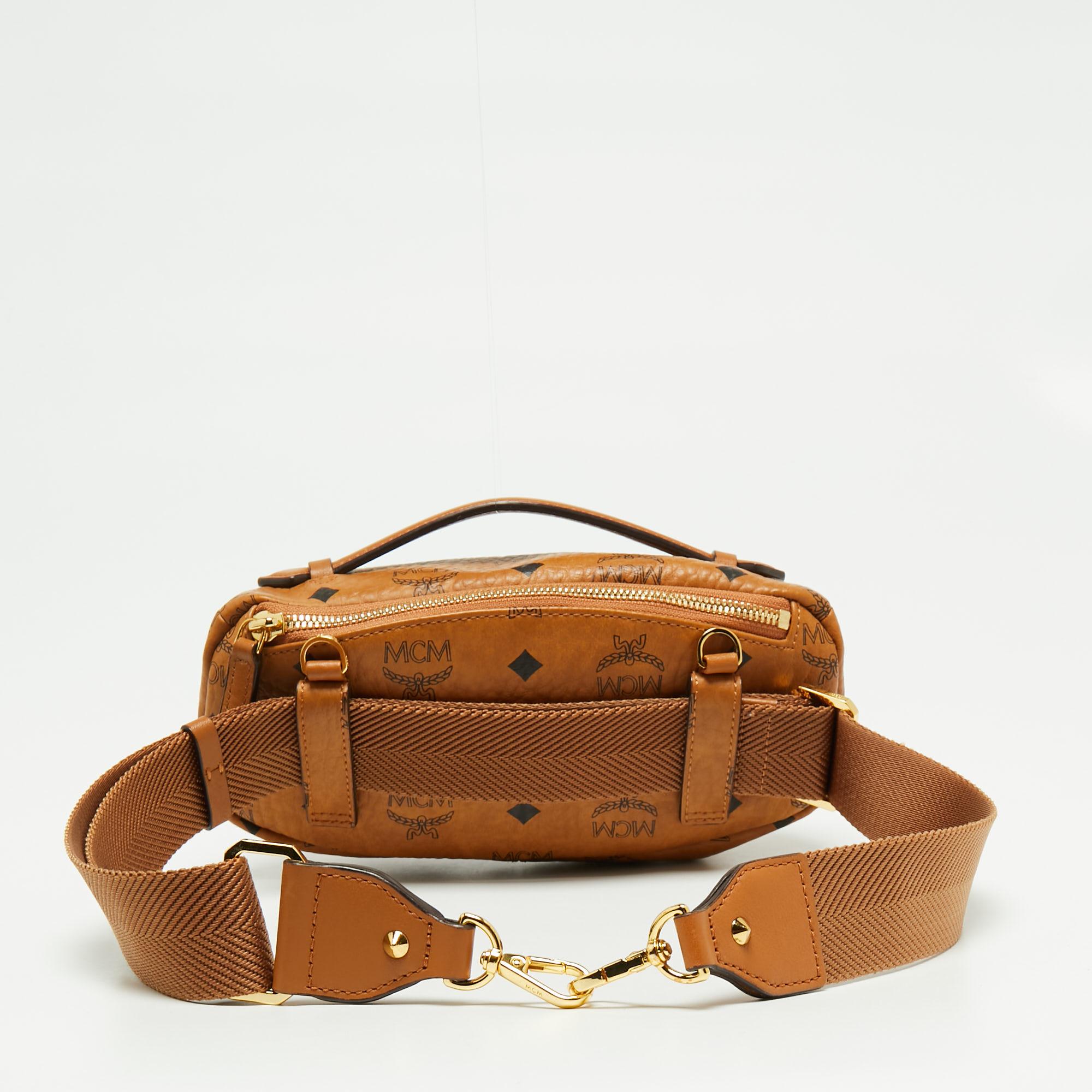 This MCM Cognac Visetos coated canvas belt bag for women highlights convenient style in the best way. The bag has gold-tone hardware accents, zip compartments, and an adjustable strap.

Includes: Original Dustbag, Original Box, Info Booklet,