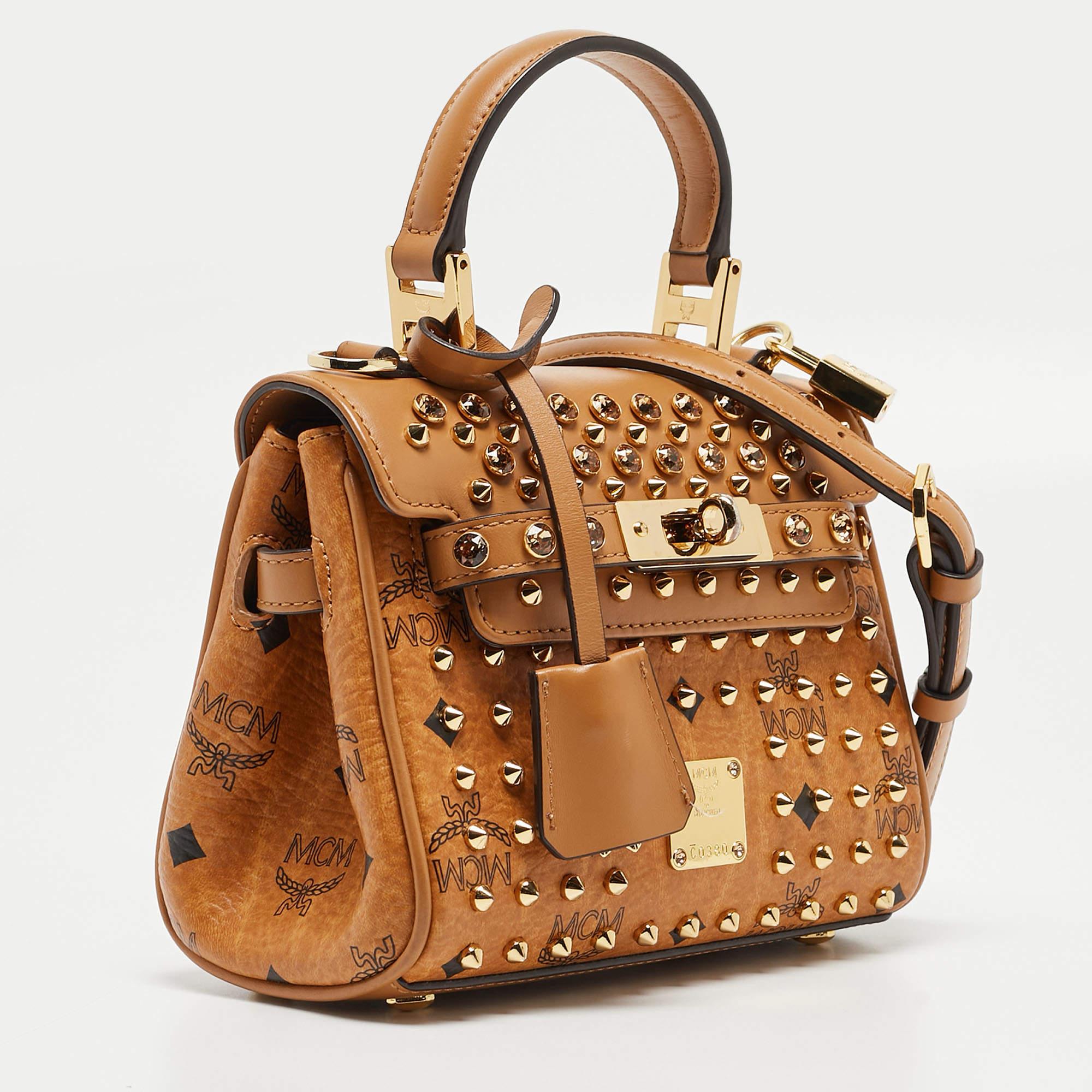 Ensure your day's essentials are in order and your outfit is complete with this MCM bag. Crafted using the best materials, the bag carries the maison's signature of artful craftsmanship and enduring appeal.


