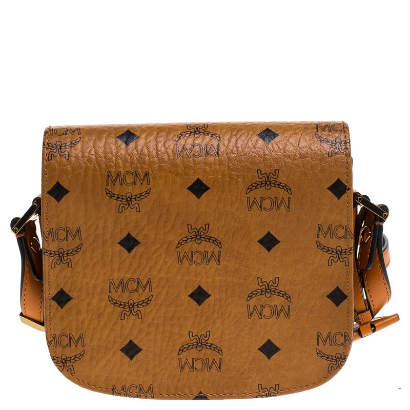 Complete your casual look with this stylish MCM Patricia bag. It is made with the signature Cognac Visetos coated canvas and comes with a long, leather shoulder strap making crossbody wear simple. The front flap opens to a spacious interior lined