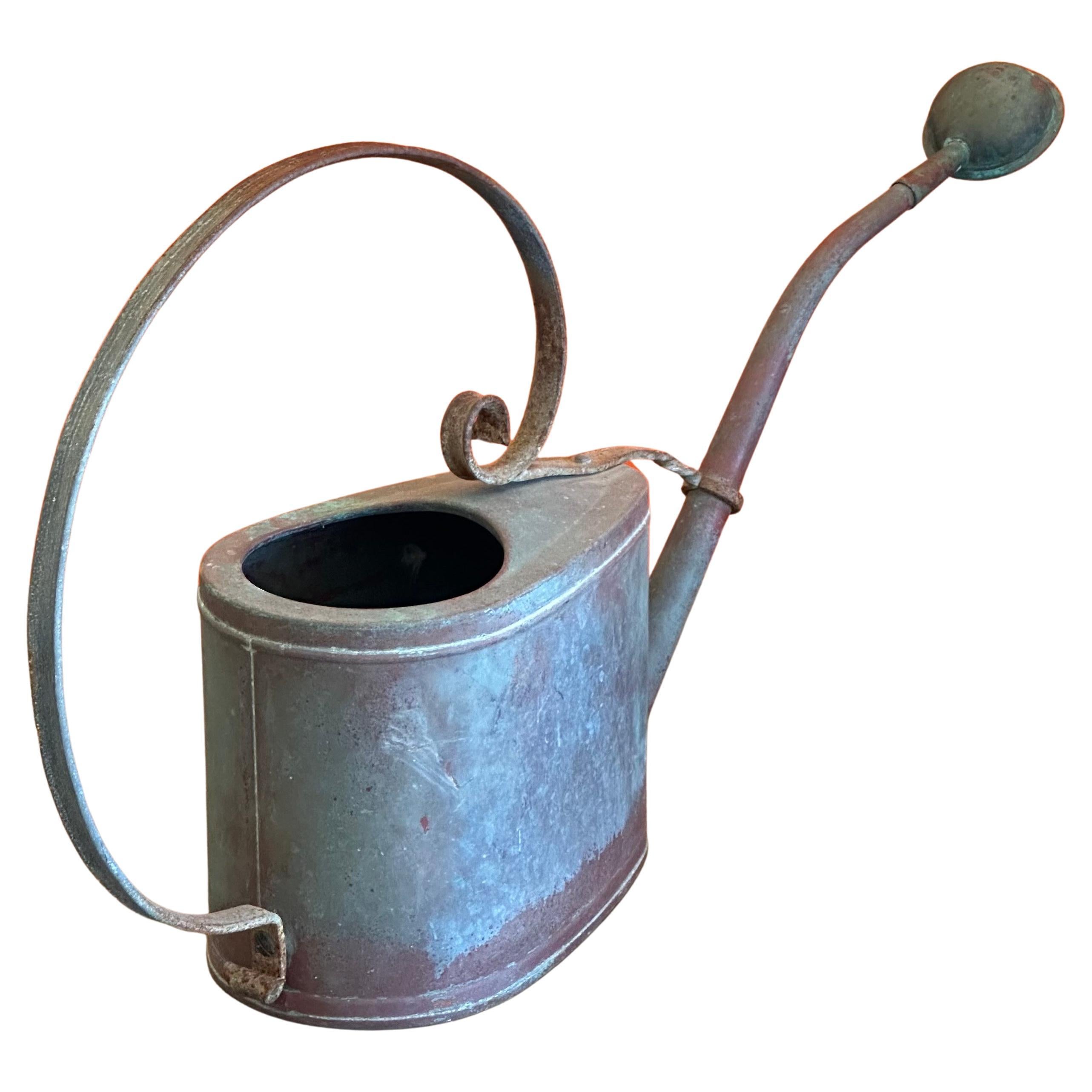 A charming mid-century copper watering can, circa 1970s. The can is in good vintage condition with a removeable spout and measures 4.5