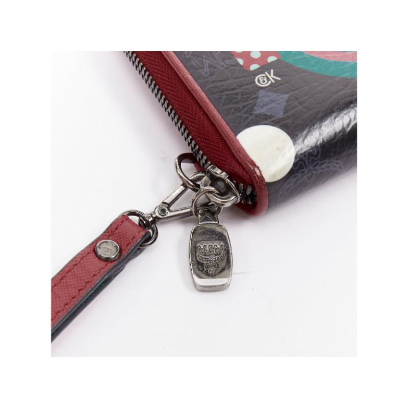 Cartera larga con cremallera MCM CRAIG KARL Beyond Snowdome de piel negra con ojo gráfico en venta 1