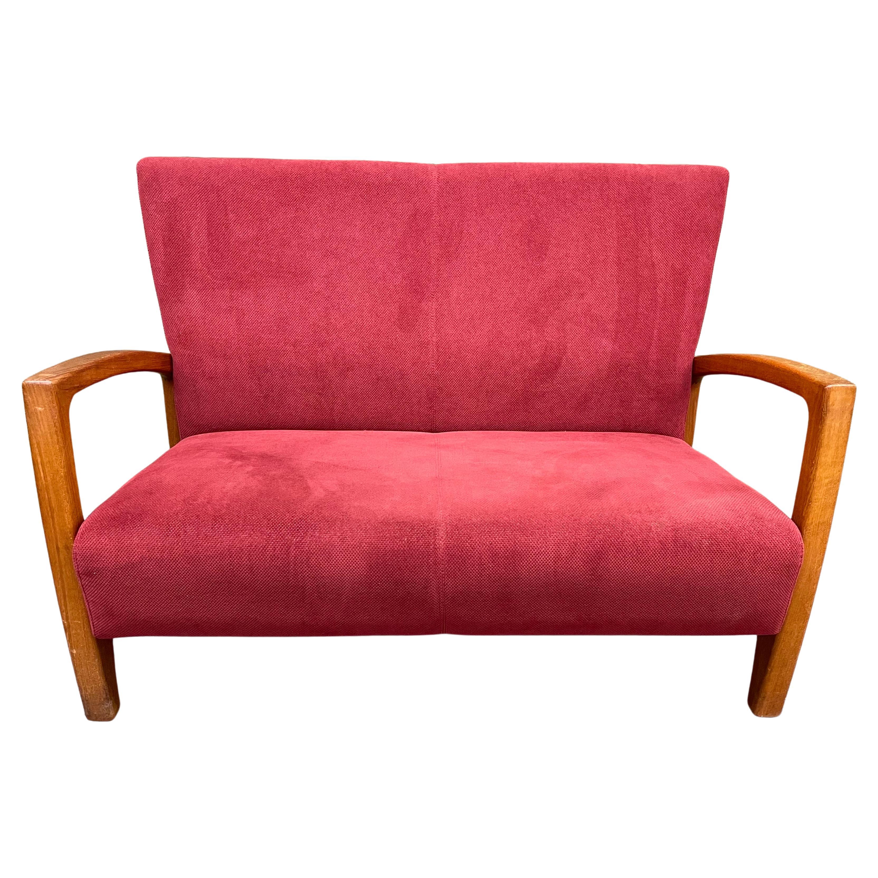 A very nice MCM Danish modern love seat / settee with teak frame, circa 1970s. Great lines and simple design on this elegant piece with red chenille fabric; the sofa is very well made (dove tailed joints) solid and sturdy! The piece measures 50