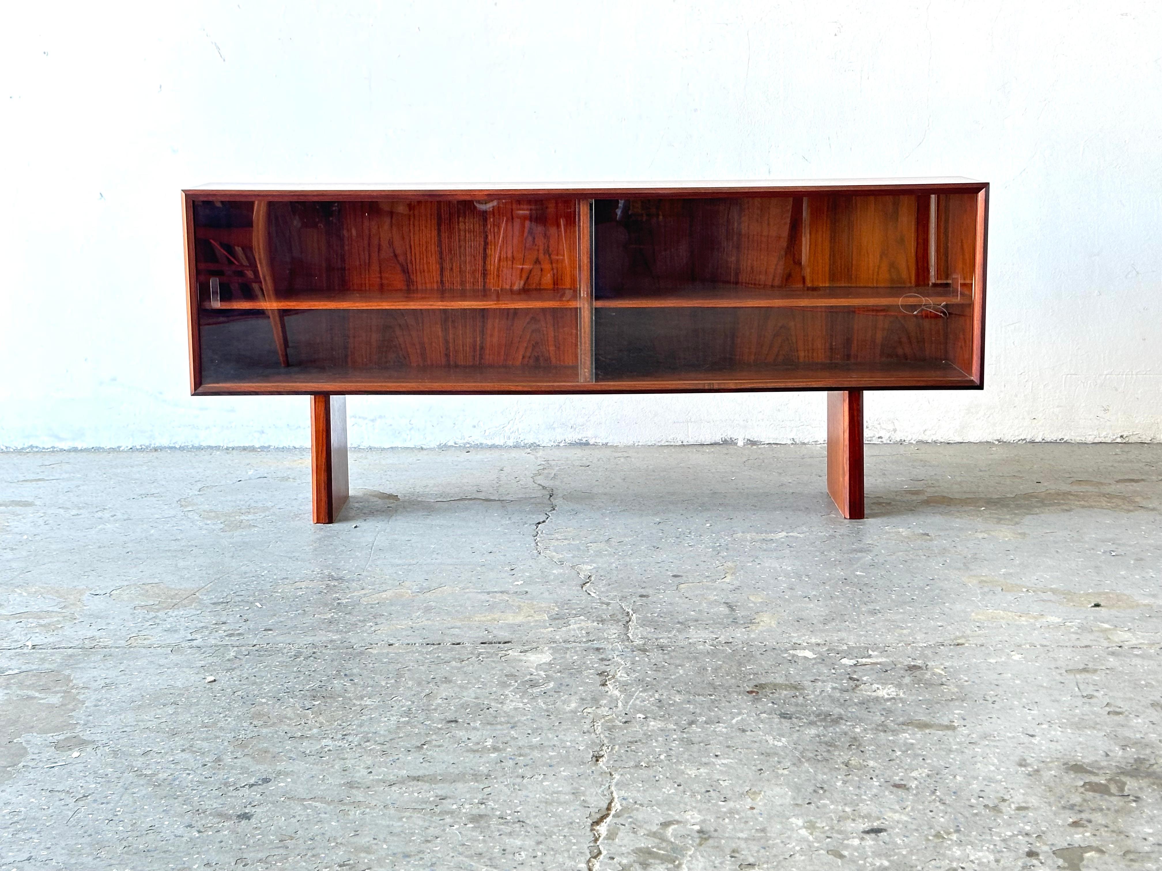 MCM Danish modern Rosewood Low Media Cabinet or Bookshelf display Case. By faarup mobelfabrik
Need a place to store books, glassware or something else cool that you like to collect? This mid century modern cabinet with glass doors is a great