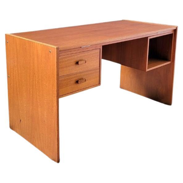 A remarkable desk that exudes elegance and sophistication. This exceptional Danish Modern desk, crafted by Nordisk Andels-Eksport in Denmark, boasts a sleek rectangular design with a tiltable drafting tabletop. On the left, you'll find two