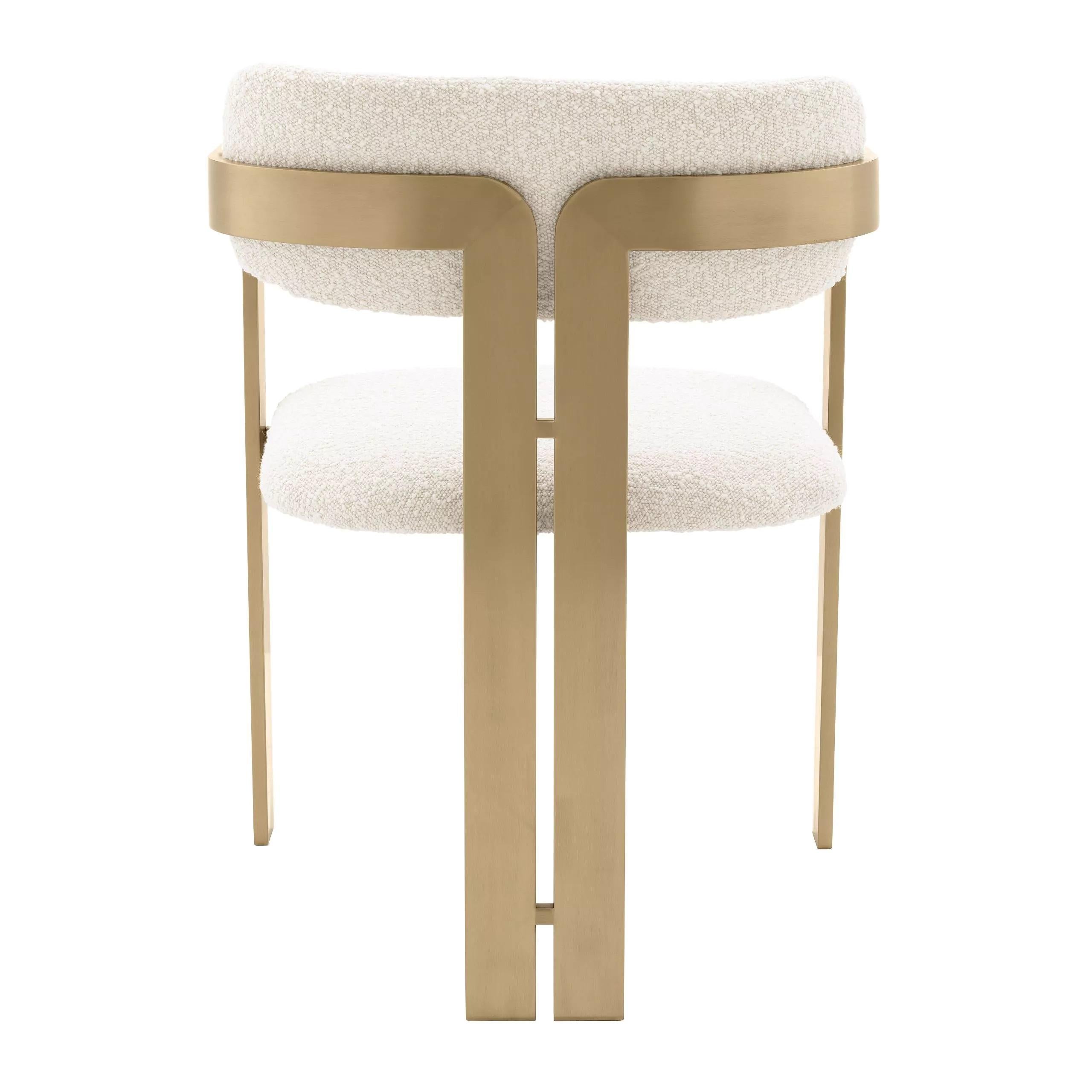 Beige Bouclé fabric and brass finishes chair.