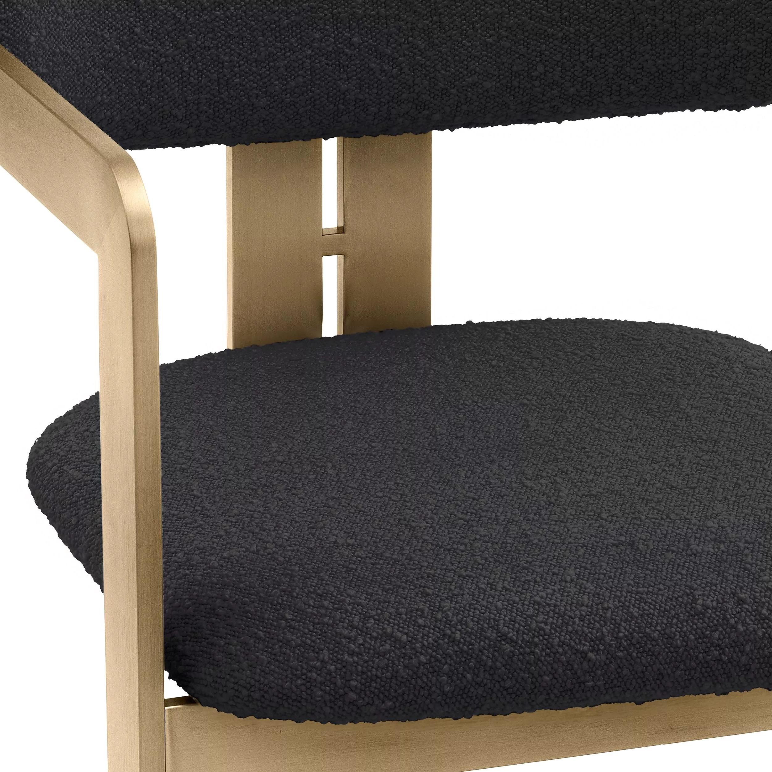 Black Bouclé fabric and brass finishes chair.