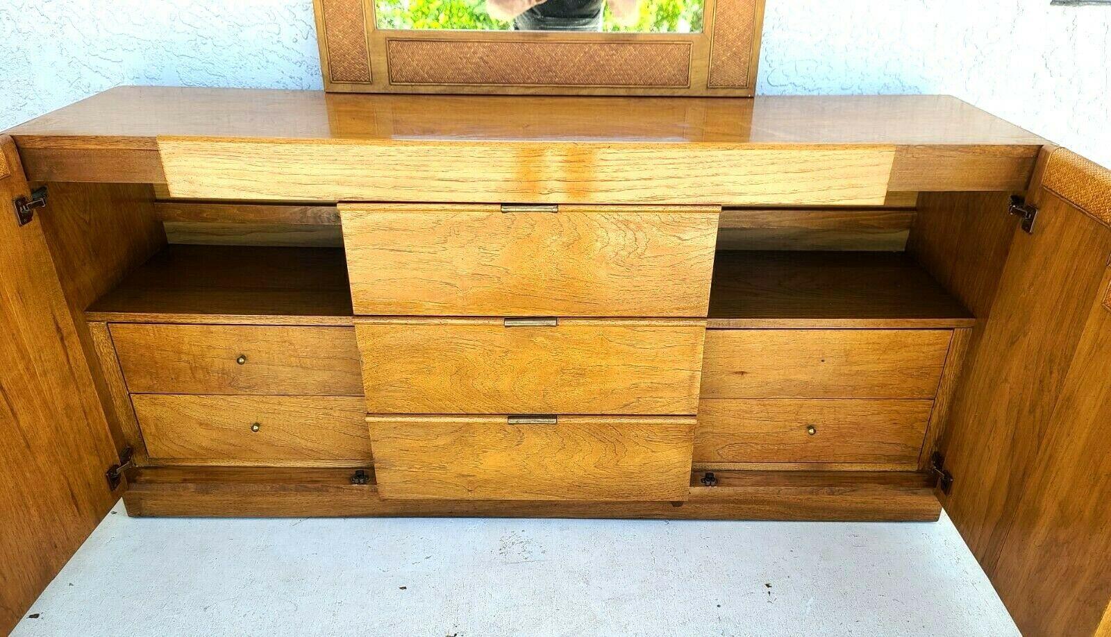 For FULL item description click on CONTINUE READING at the bottom of this page.

Offering One Of Our Recent Palm Beach Estate Fine Furniture Acquisitions Of A
Founders Mid-Century Modern Campaign Style Dresser or Credenza with Wicker Front Doors