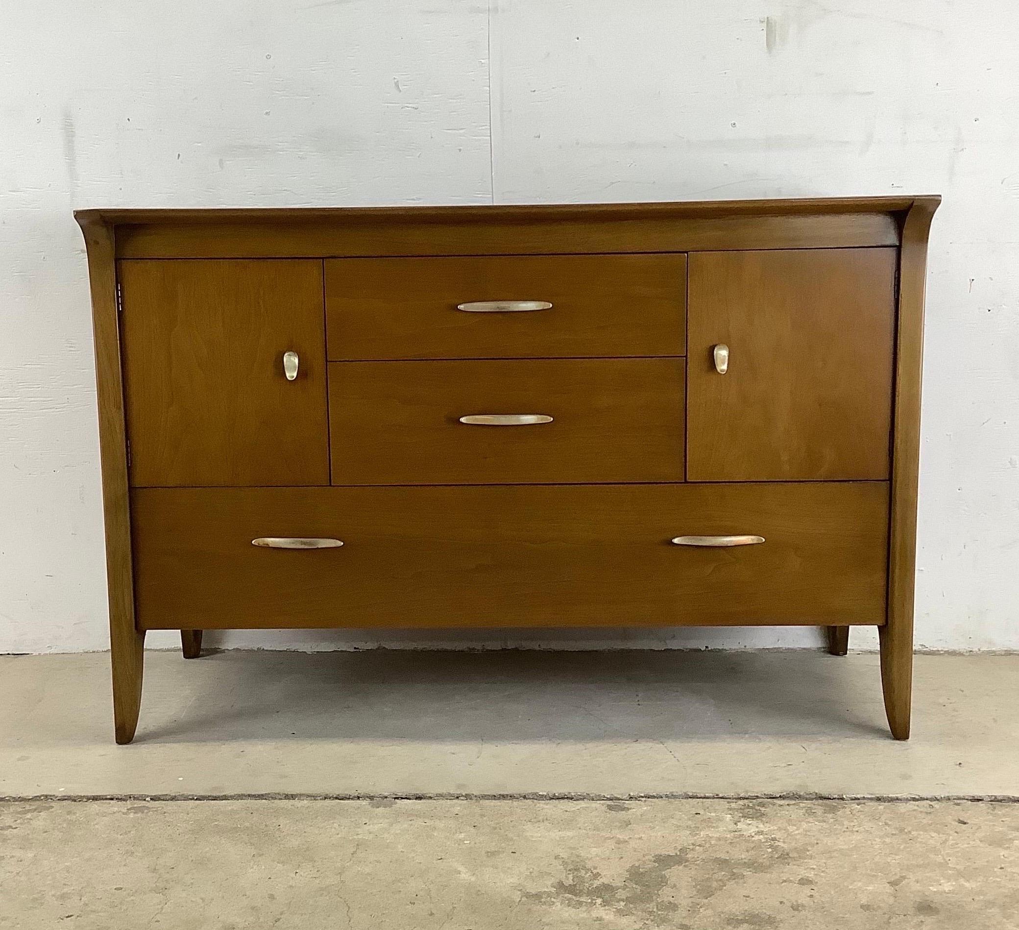 This impressive Mid-Century Modern sideboard with breakfront display topper was designed by John Van Koert for Drexel's Profile line of furniture. Original wood finish is in great condition with spacious interior storage and unique metal pulls.