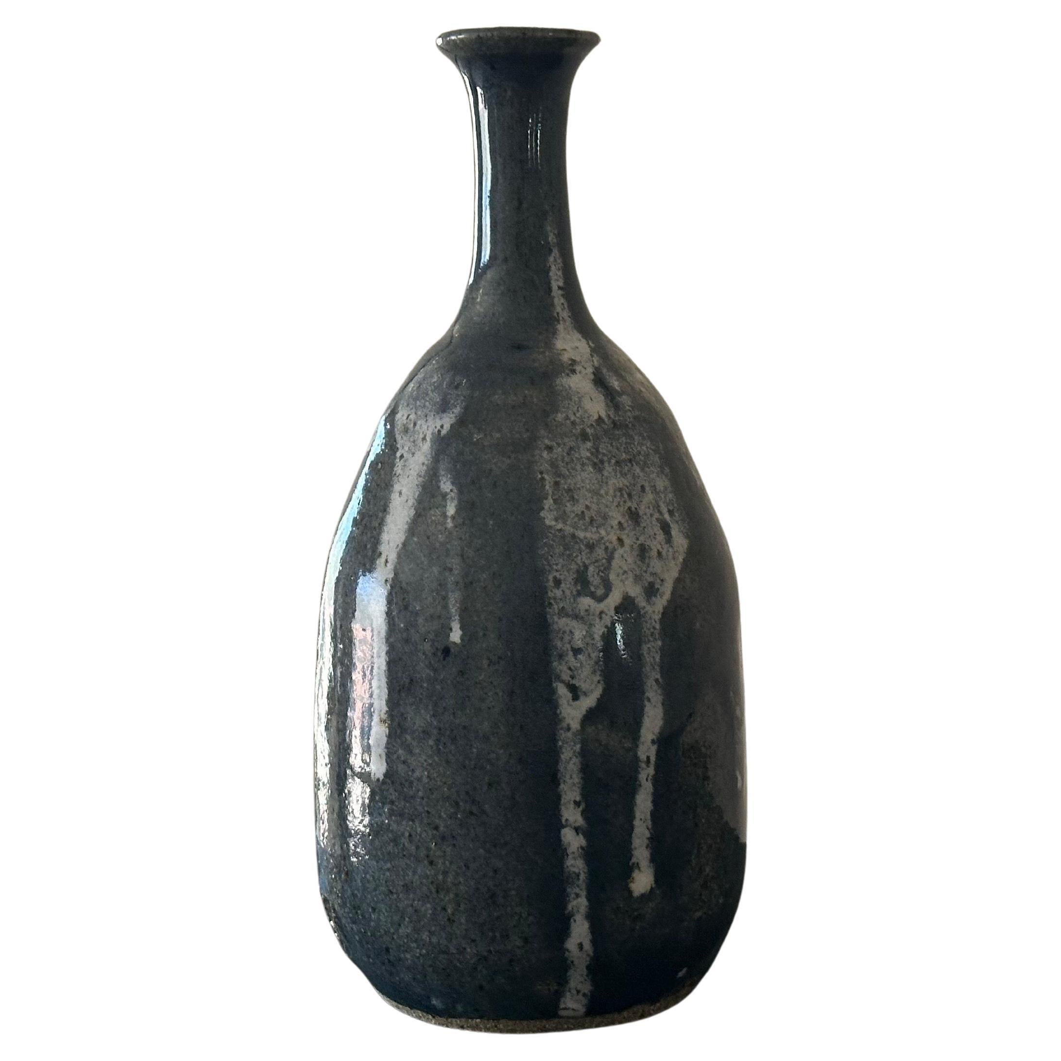 A nice MCM drip glaze studio pottery stoneware vase, circa 1970s.  The piece is in very good vintage condition with no chips or cracks and measures approximately 4