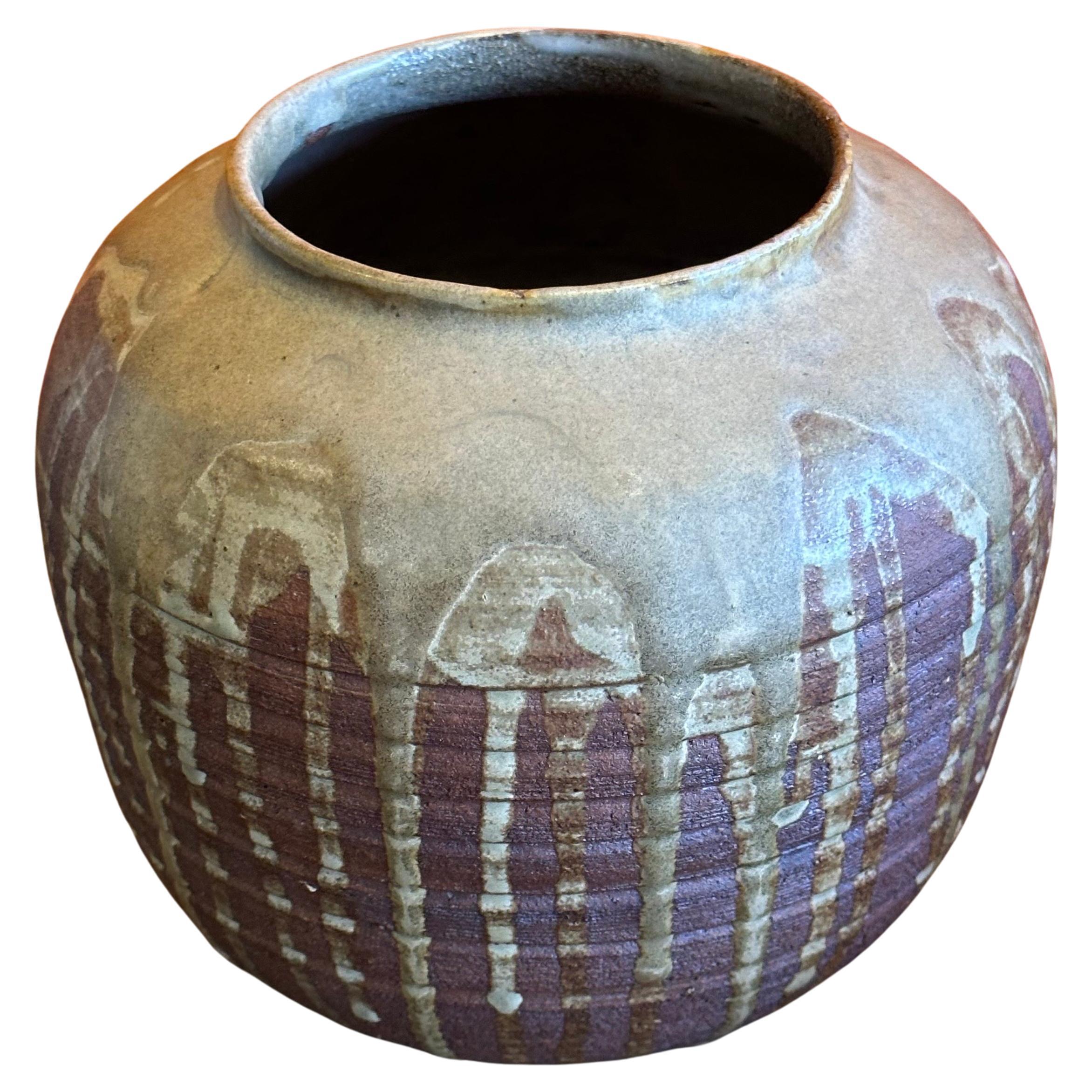 A nice MCM drip glaze studio pottery stoneware vase by Del Soto, circa 1971.  The piece is in very good vintage condition with no chips or cracks and measures 7.5