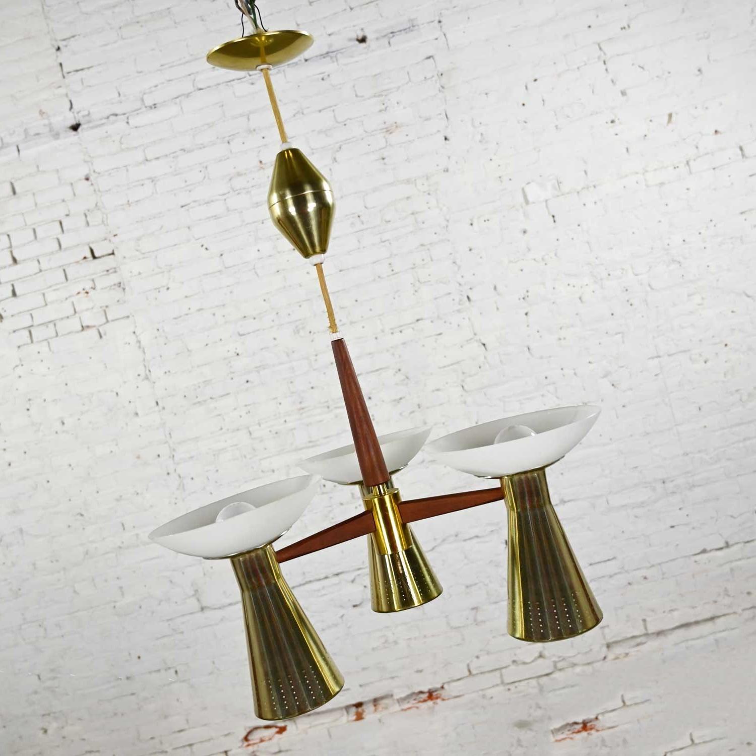 Fabulous Mid-Century Modern Emerson by Imperialites pull down & retractable pendant light fixture or chandelier comprised of walnut, brass plate, six lights, and white glass bowl shaped shades. Beautiful condition, keeping in mind that this is