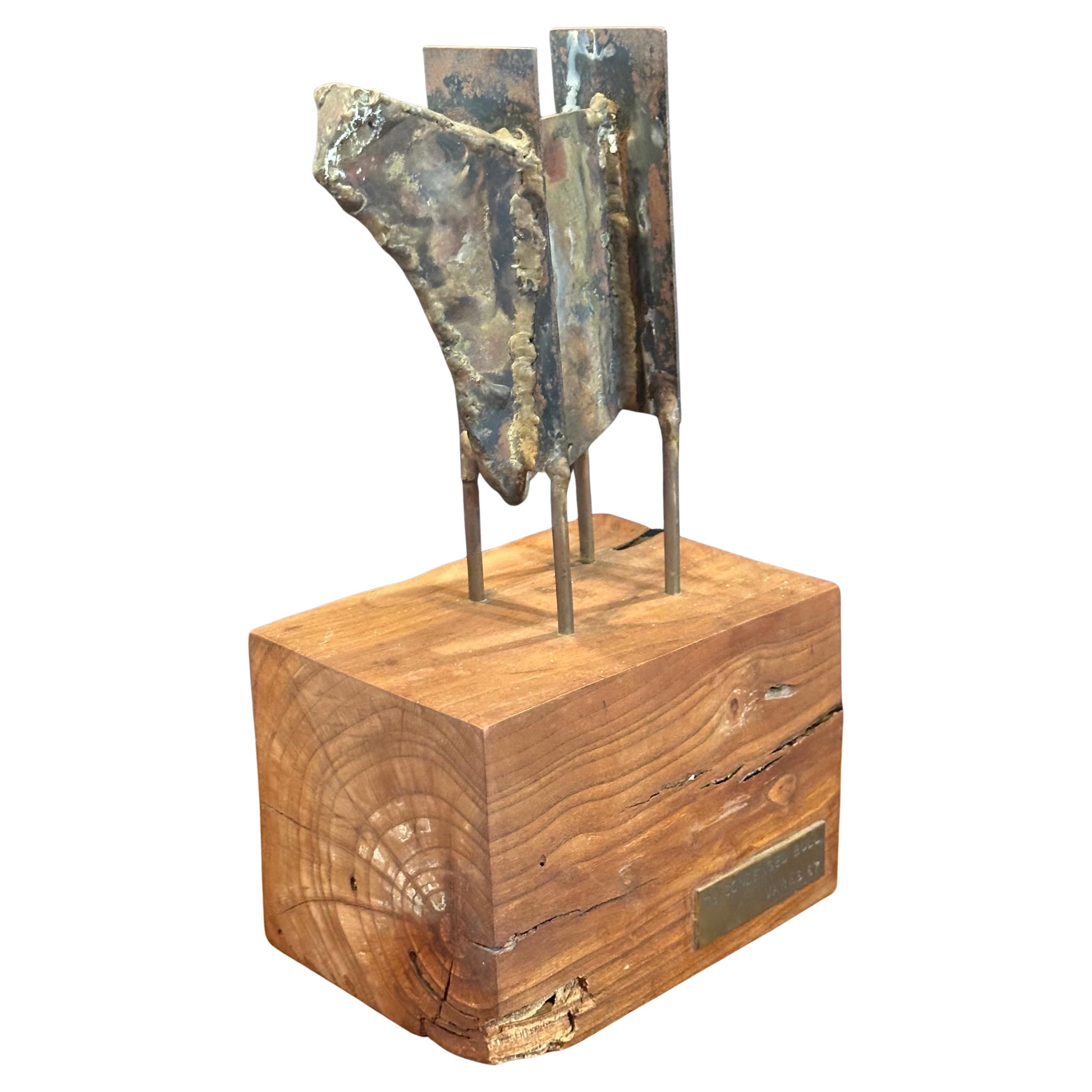 Mid-century figural bull sculpture on solid wood base entitled 