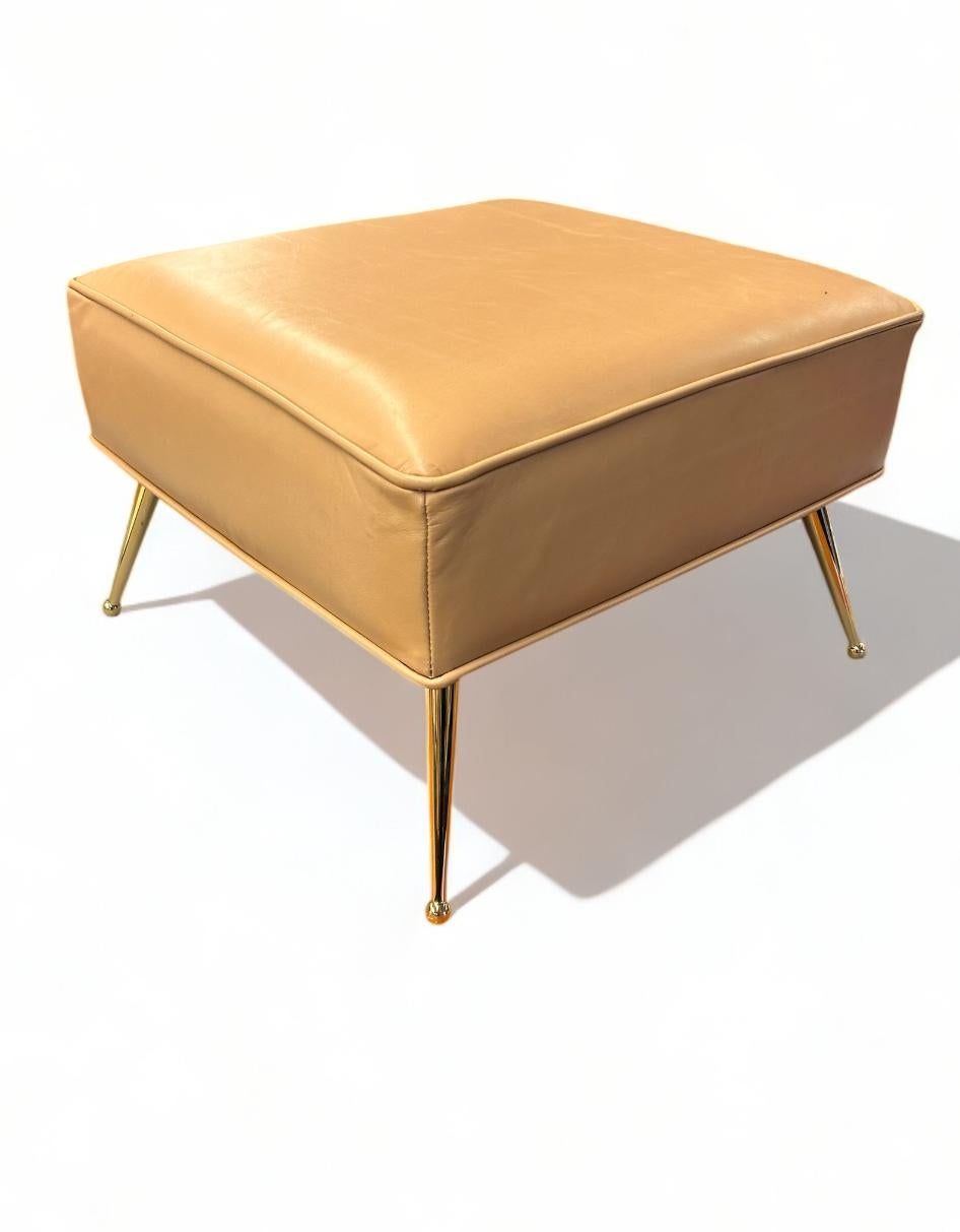 This bespoke pair of MCM inspired foot stools are crafted in supple Italian leather with clean and elegant lines. The legs are reclaimed, vintage solid brass with ball feet. Solid and sturdy, these footstools are created with the highest level of
