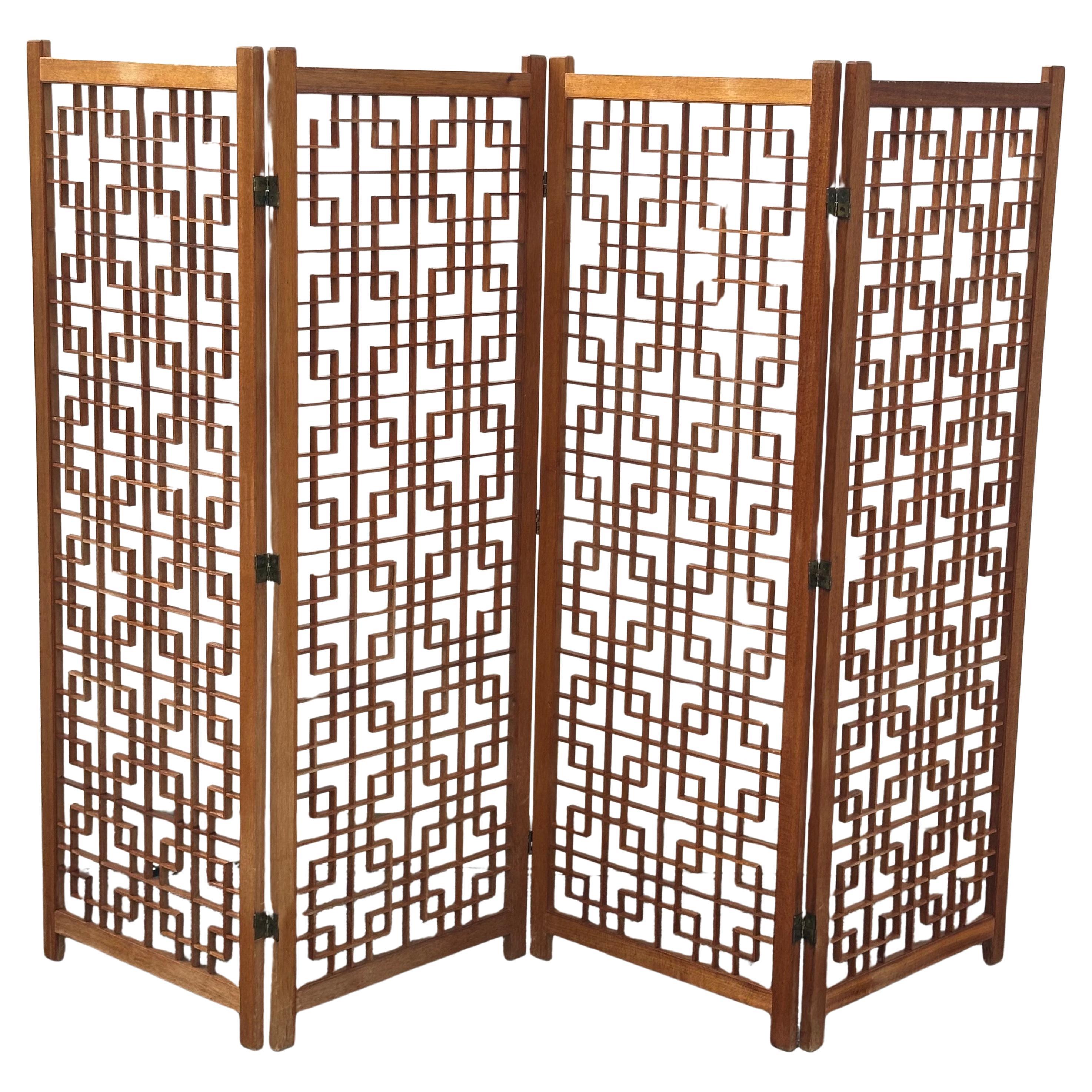A very cool and hard to find four panel teak folding screen with intricate square lattice design, circa 1970s. Each individual panel measures 24