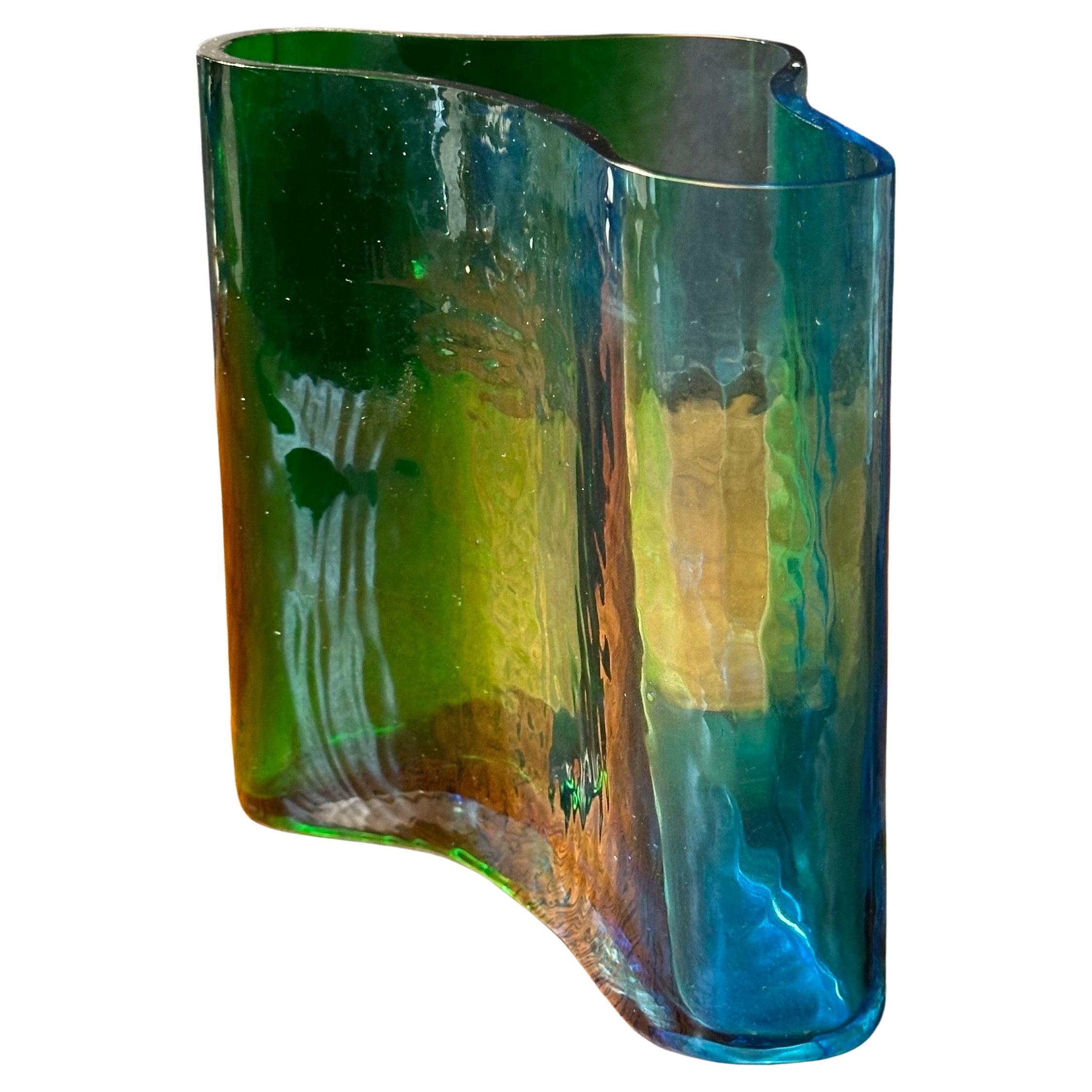 A super cool MCM free form art glass vase in the style of Alvar Aalto, circa 1970s. The vase is in very good vintage condition with no chips or cracks and measures 6