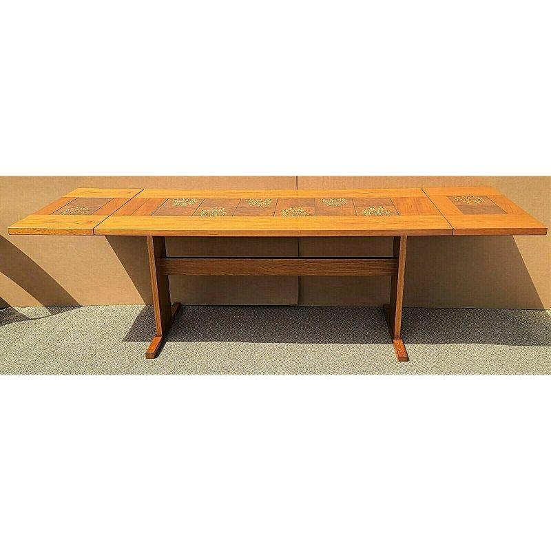 For FULL item description click on CONTINUE READING at the bottom of this page.

Offering One Of Our Recent Palm Beach Estate Fine Furniture Acquisitions Of A
Vintage MCM Gangso Mobler teak & botanical tile drop leaf dining table.

Featuring inlaid