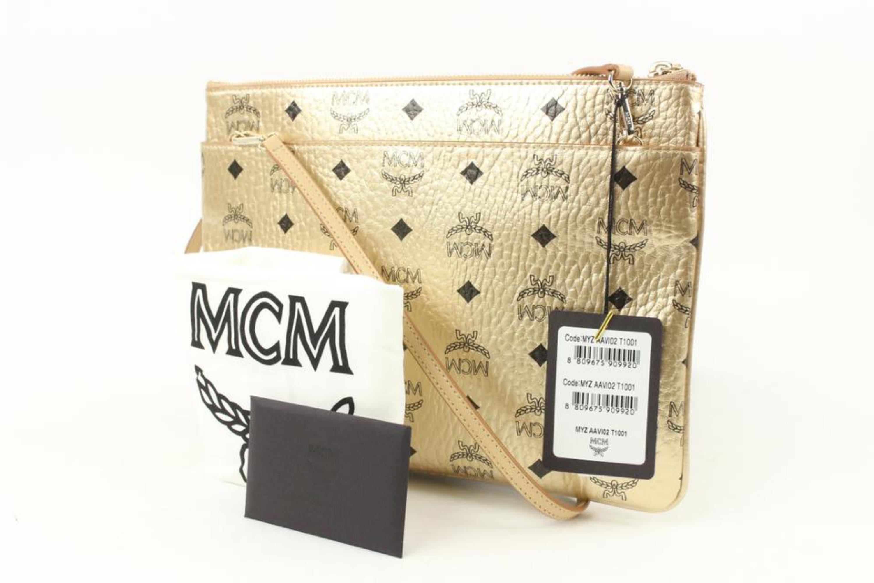 MCM Gold Monogram Visetos Logo Crossbody Pouch Bag Pochette 114m59
Date Code/Serial Number: MYZAAVI02T1001 10152102
Made In: Korea
Measurements: Length: 11.5