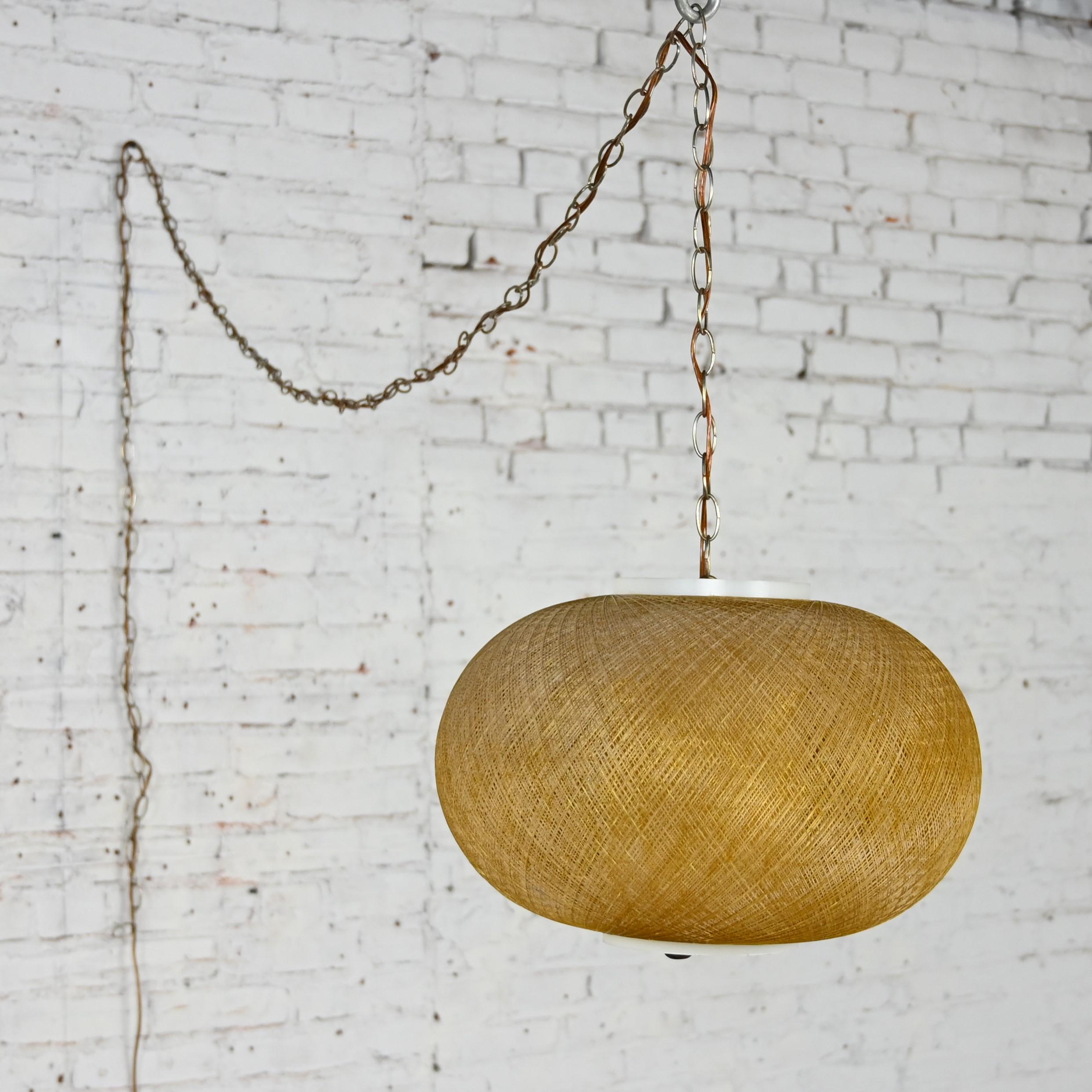 Gorgeous Mid-20th Century Mid Century Modern gold spun fiberglass string swag or pendant hanging light fixture or lamp.  Beautiful condition, keeping in mind that this is vintage and not new so will have signs of use and wear even if it has been