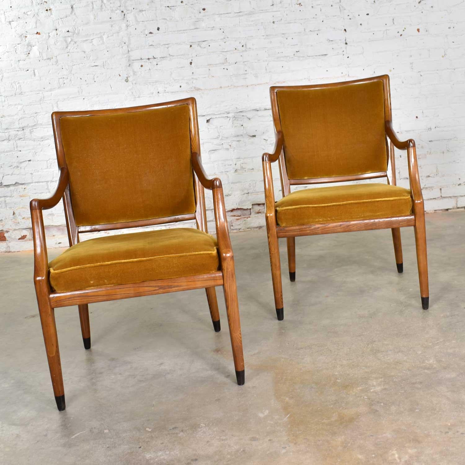 Handsome pair of MCM, or Mid-Century Modern, Grand Haven accent armchairs designed by Jack Van der Molen for Jamestown Lounge Company. They wear their original gold velvet upholstery and are done in light oak. They are in fabulous vintage condition.