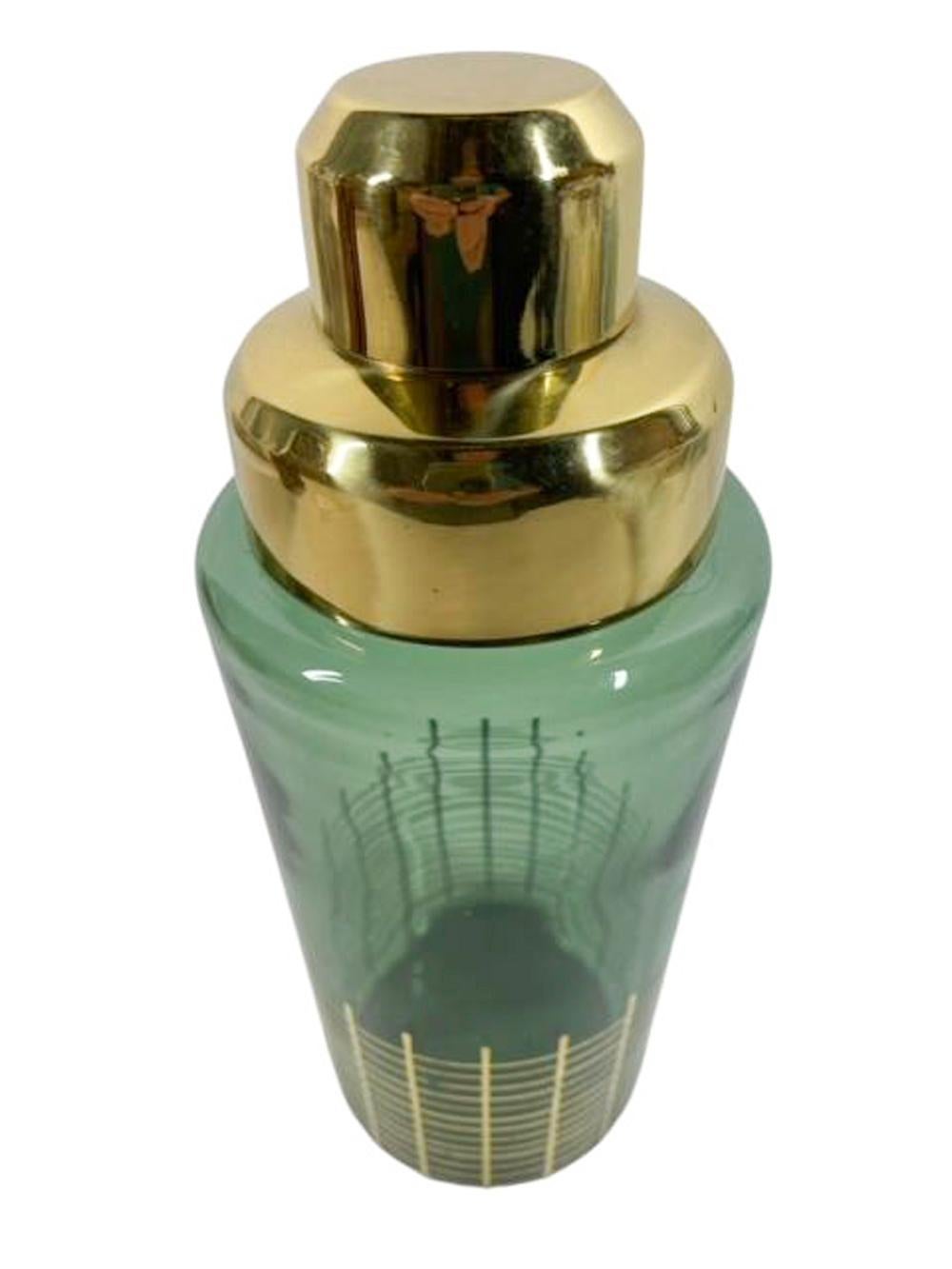Vintage green glass cocktail shaker of cobbler form decorated at the base with a grid pattern in 22k gold and topped with a gold-tone lid and cap.