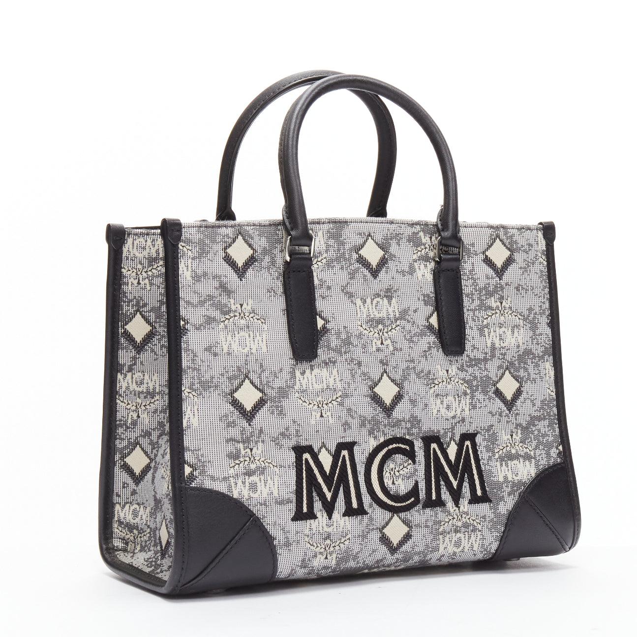 MCM grey vintage logo jacquard canvas embroidery small tote bag
Reference: CAWG/A00303
Brand: MCM
Material: Fabric, Leather
Color: Black, Grey
Pattern: Solid
Closure: Lobster Clasp
Lining: Beige Fabric
Extra Details: Signature monogram. Vintage