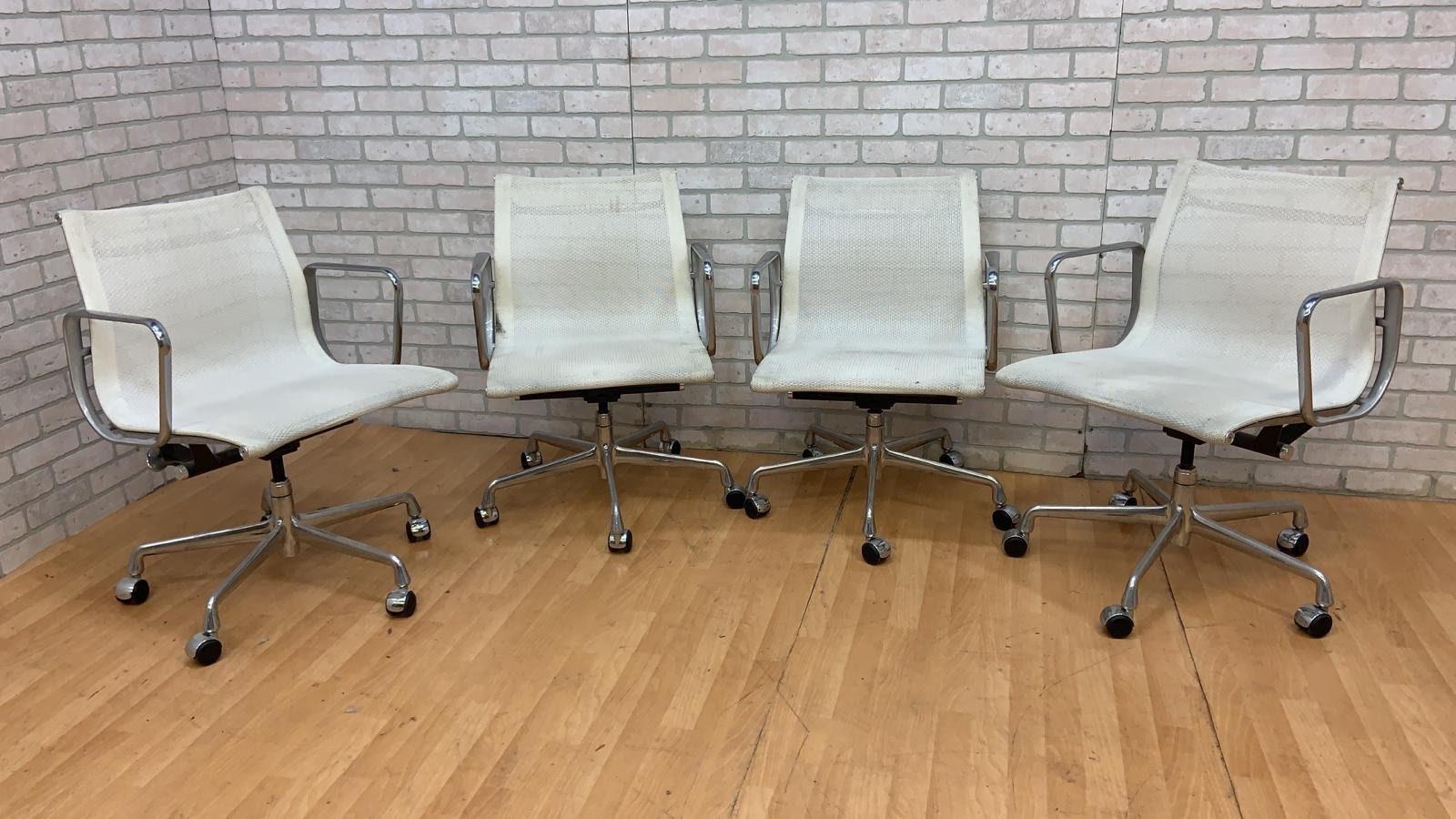 Mid-Century Modern Herman Miller style low back white mesh office chairs - set of 4

These chairs features a white mesh sling seating area, high back, adjustable lightweight aluminum frame and casters for 360-degree swivel. Extremely comfortable.