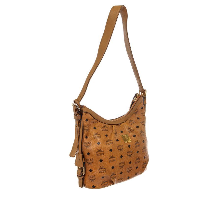 MCM hobo bag features cognac Monogram Visetos coated canvas, gold-tone hardware, single shoulder strap, beige canvas lining & three interior pockets, zip closure at top and protective feet at base.
 

66735MSC

Height: 11