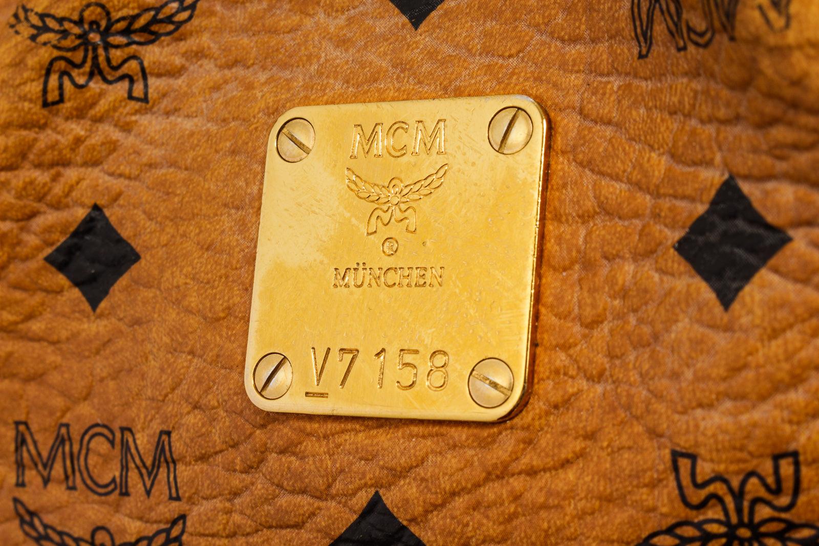 MCM Hobo-Tasche aus beschichtetem Segeltuch mit cognacfarbenem Visetos-Monogramm und goldfarbenen Beschlägen Damen