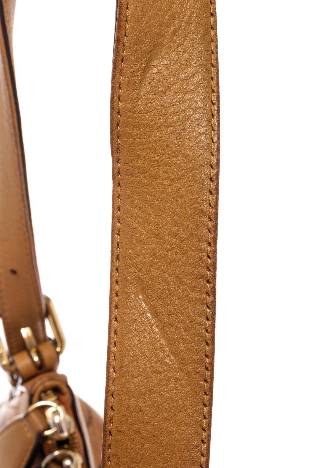 Brown MCM hobo bag features cognac Monogram Visetos coated canvas, gold-tone hardware
