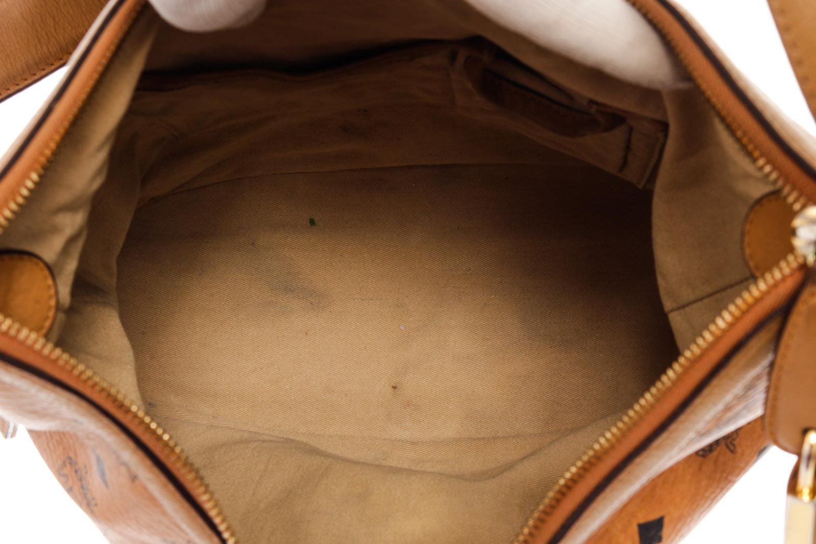 MCM hobo bag features cognac Monogram Visetos coated canvas, gold-tone hardware In Fair Condition In Irvine, CA