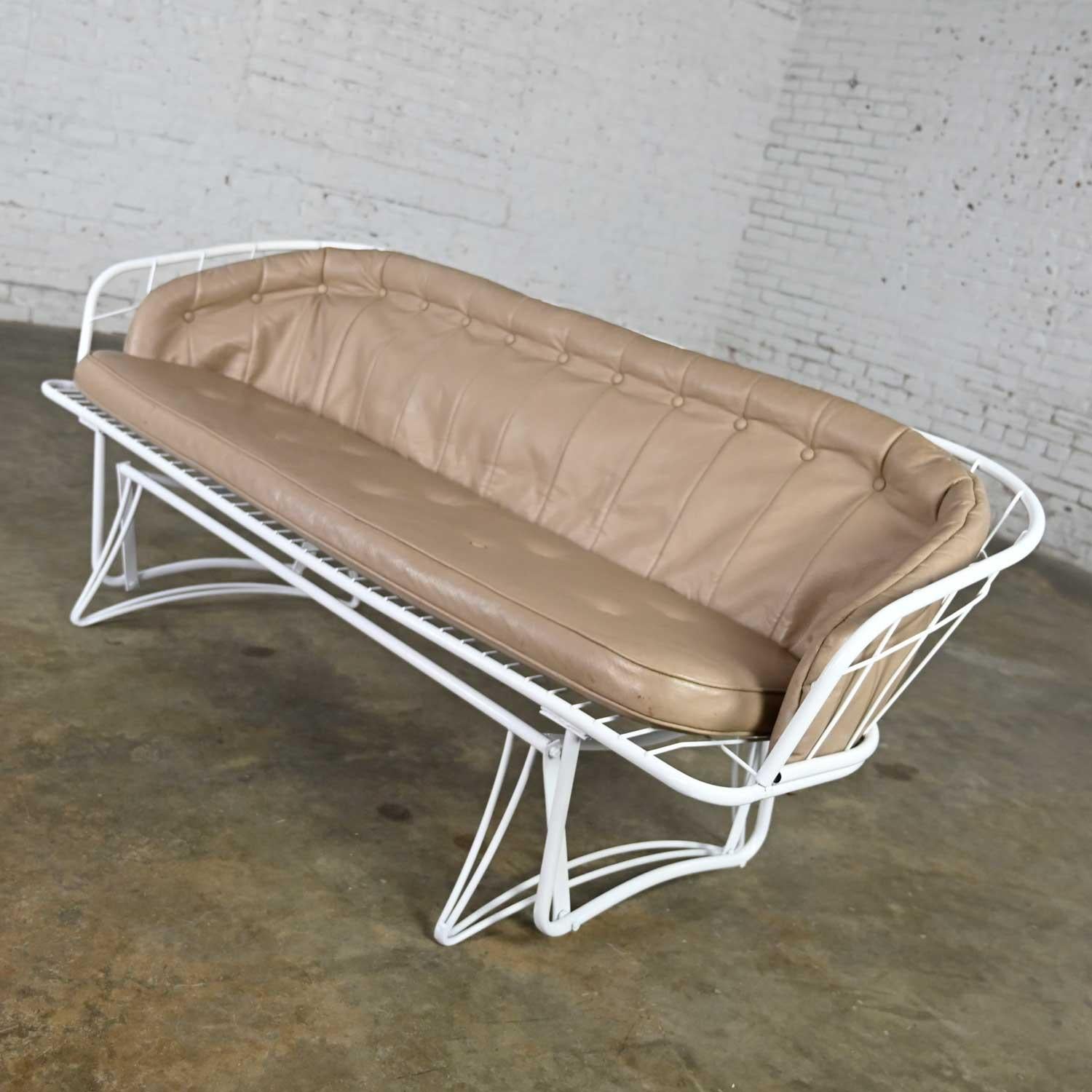 Wonderful Mid-Century Modern Homecrest white painted metal glider with taupe vinyl cushions and button detail. Beautiful condition, keeping in mind that this is vintage and not new so will have signs of use and wear. It has been completely