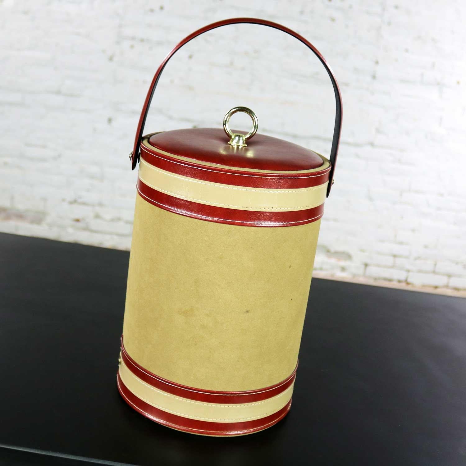 Handsome vintage mid-century modern ice bucket signed by George Briard original tan & rust faux suede leather with brass toned ring knob handle. Beautiful condition, keeping in mind that this is vintage and not new so will have signs of use and wear