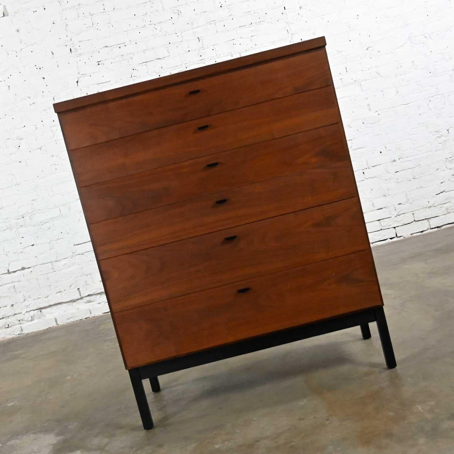 Vintage MCM or Mid-Century Modern Jack Cartwright for Founders Furniture Patterns 10 walnut chest of drawers or high-boy dresser comprised of 6 drawers with black pulls and a burnt umber base and legs. Beautiful condition, keeping in mind that this