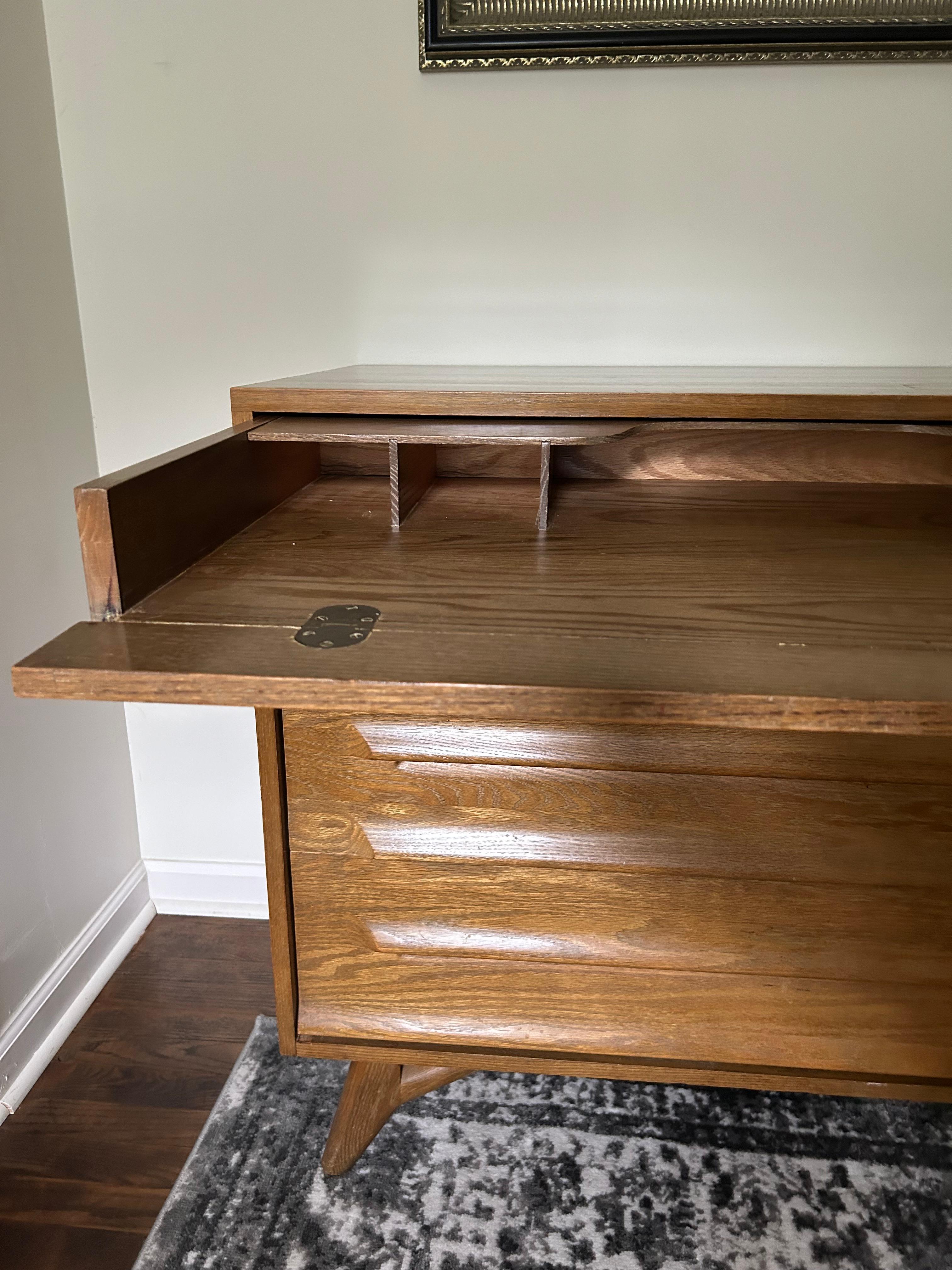 MCM Jack Van Der Molen Secretary Desk and Dresser for Vanleigh. The first drawer pulls out as a writing desk, the second drawer is also narrow but is a regular drawer. There are also 2 large drawers at the bottom. The condition is good, although has