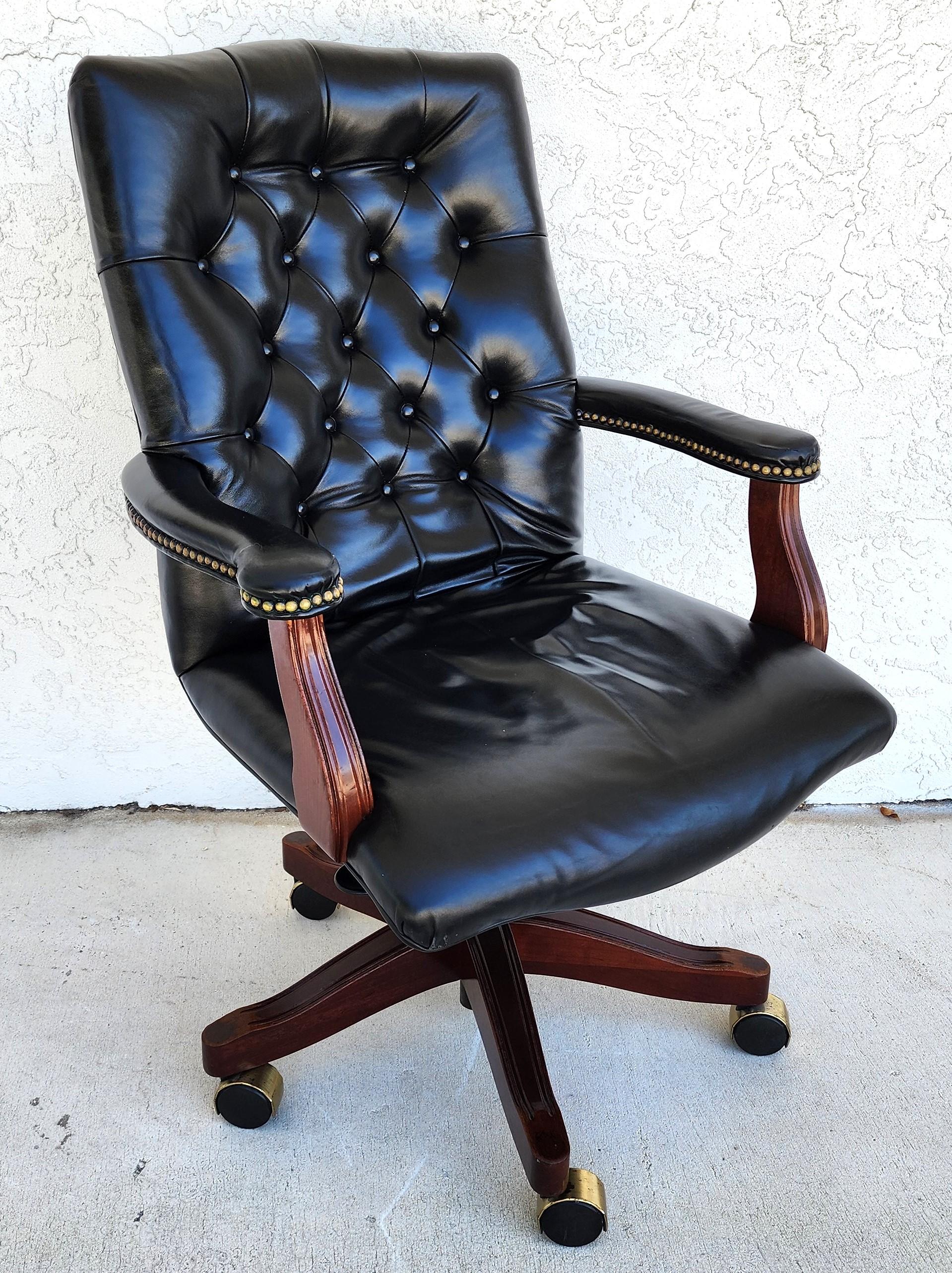 For FULL item description click on CONTINUE READING at the bottom of this page.

Offering One Of Our Recent Palm Beach Estate Fine Furniture Acquisitions Of A
Classic Vintage MCM Black Leather Swivel Office Chair by GUNLOCKE
Featuring an adjustable