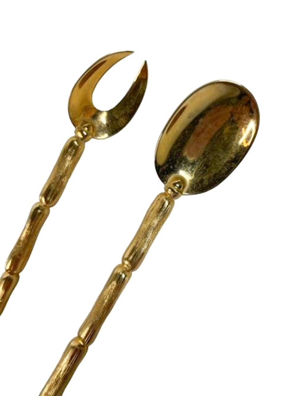 Mid century gold plated bar tools, stir spoon and olive fork with long bamboo form handles and ovoid bowls.