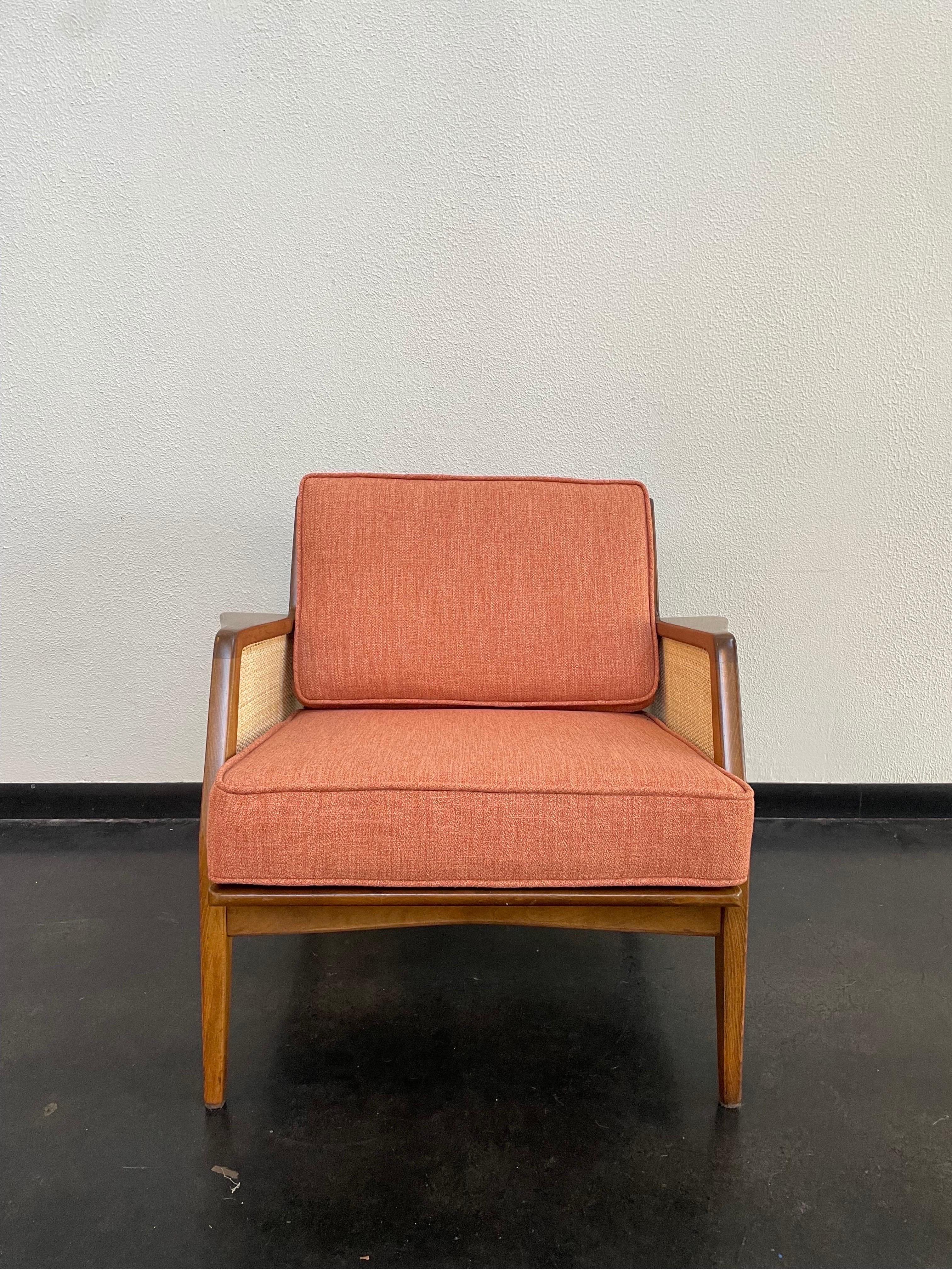 Vintage Mid-Century Modern lounge chair with brand new salmon toned upholstery and new cane panels.