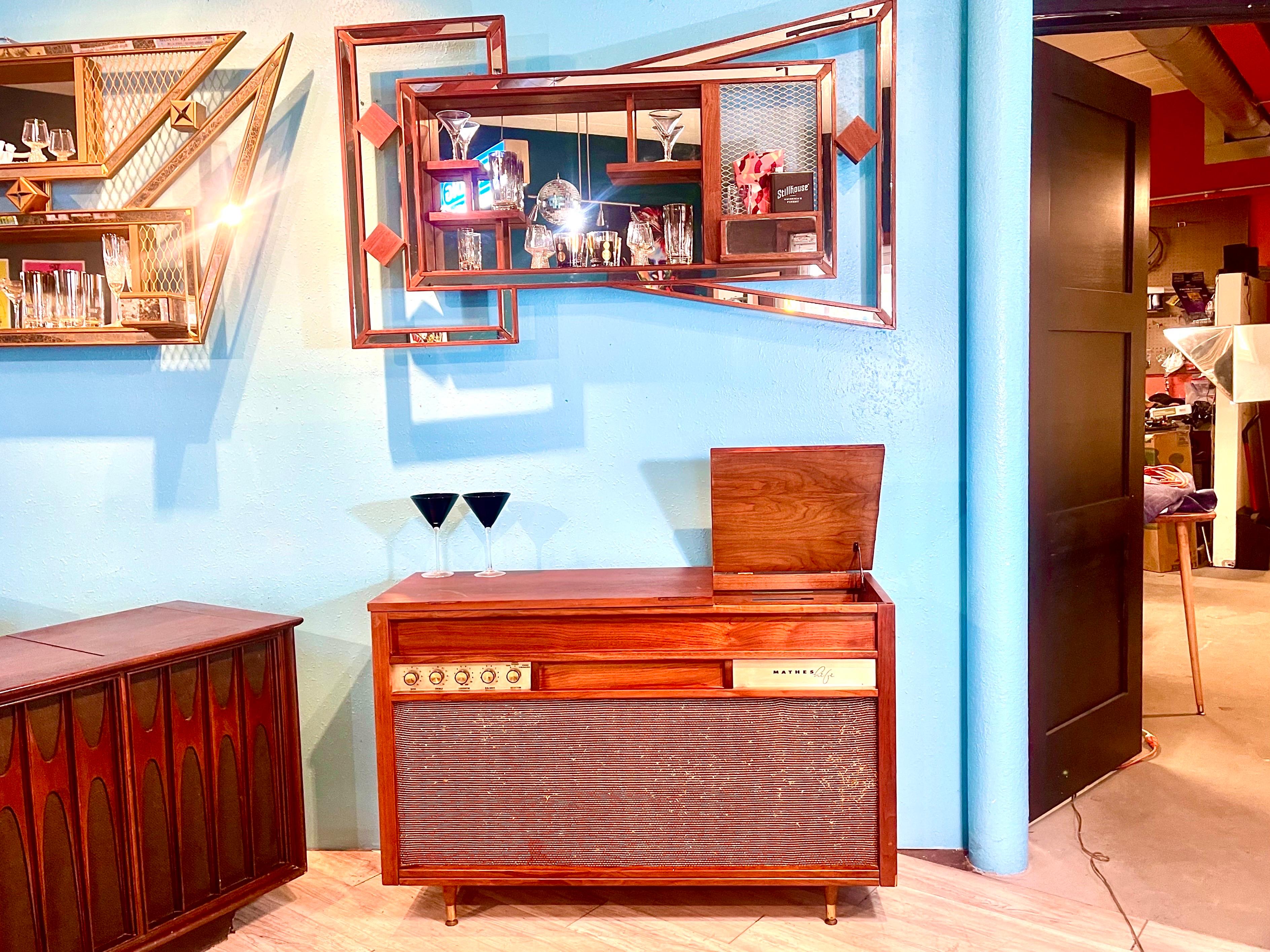 Thanks for looking at this refinished cabinet mid century stereo console.

This is a cherished and much respected stereo cabinet of the Madmen era. It shows great time period patina but refinished to a great looking piece. The original receiver is