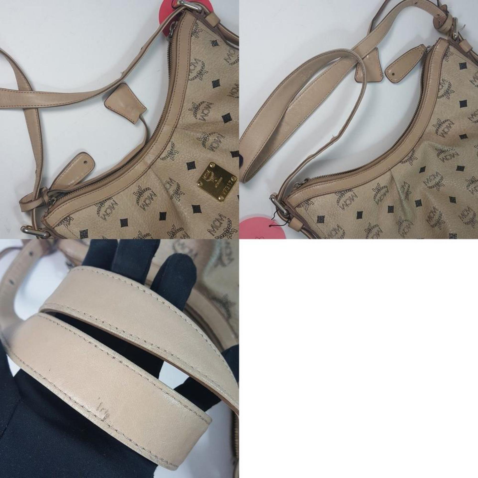Brand : MCM
Style : Hobo Shoulder Bag
Model : Visetos Hobo Shoulder Bag Beige
Code : V7317
Material : Visetos Canvas
Color : Ext) Beige, Int) Brown
Country of Manufacture : Korea, Republic of
Size : W 13.3 x H 11 x D 4.7 Inch (W 34 x H 28 x D 12