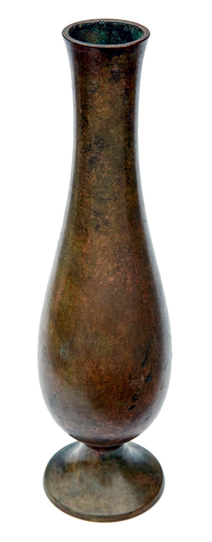 Smooth bronze vase with a mottled surface. The vessel sits on a round base. Unmarked & in excellent condition.