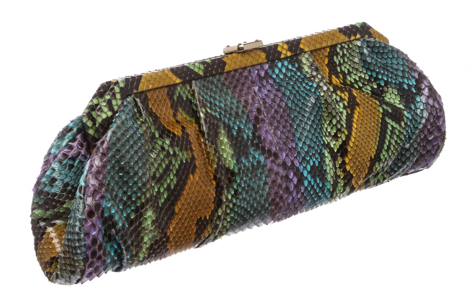 MCM multicolor snakeskin leather long clutch with gold tone snap closure. Inner brown fabric lined and one side zip pocket. 

23139MSC
