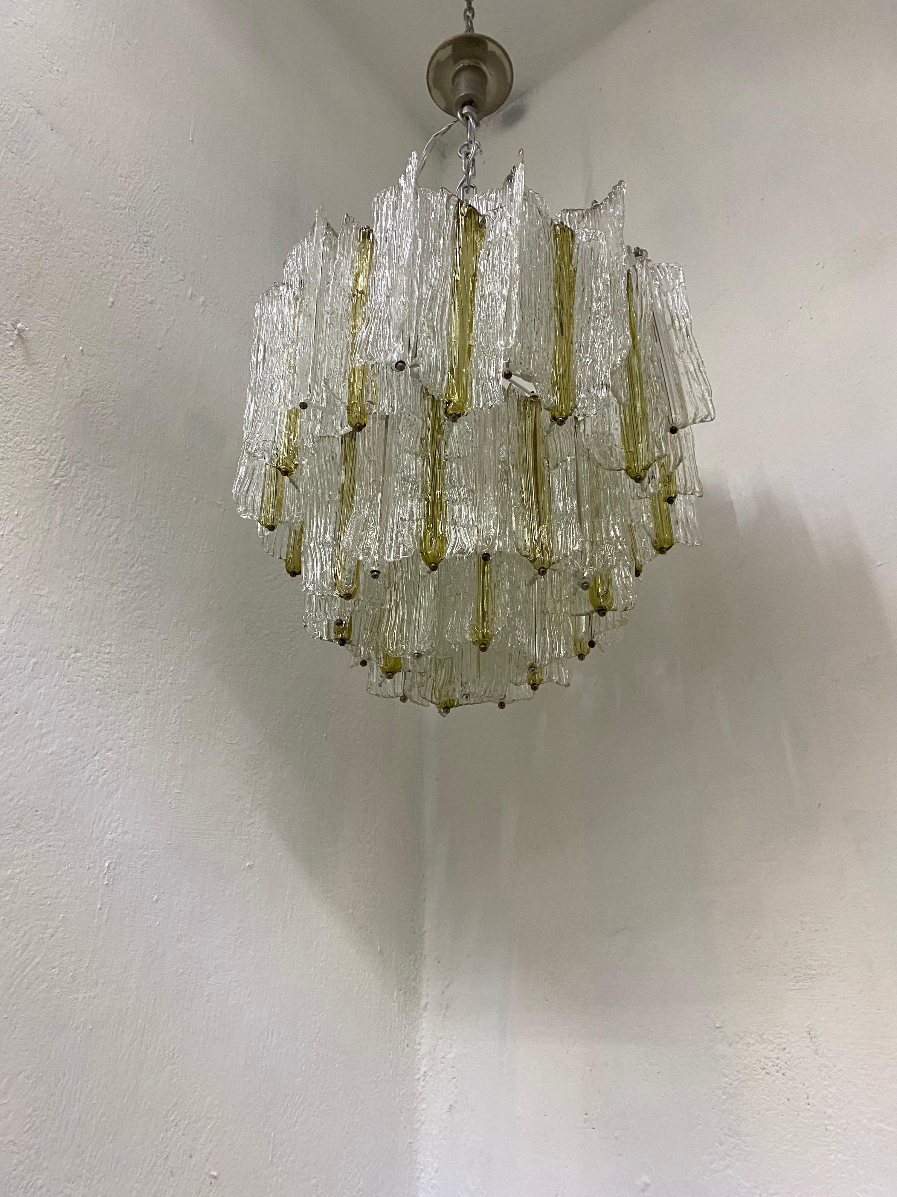 Large Mid-Century Modern chandelier in hand blown Murano glass.
This model was designed by Toni Zuccheri and manufactured by Venini in Murano Italy circa 1970.
The pieces are executed in clear and amber coloured glass, there are 53 pieces in total,