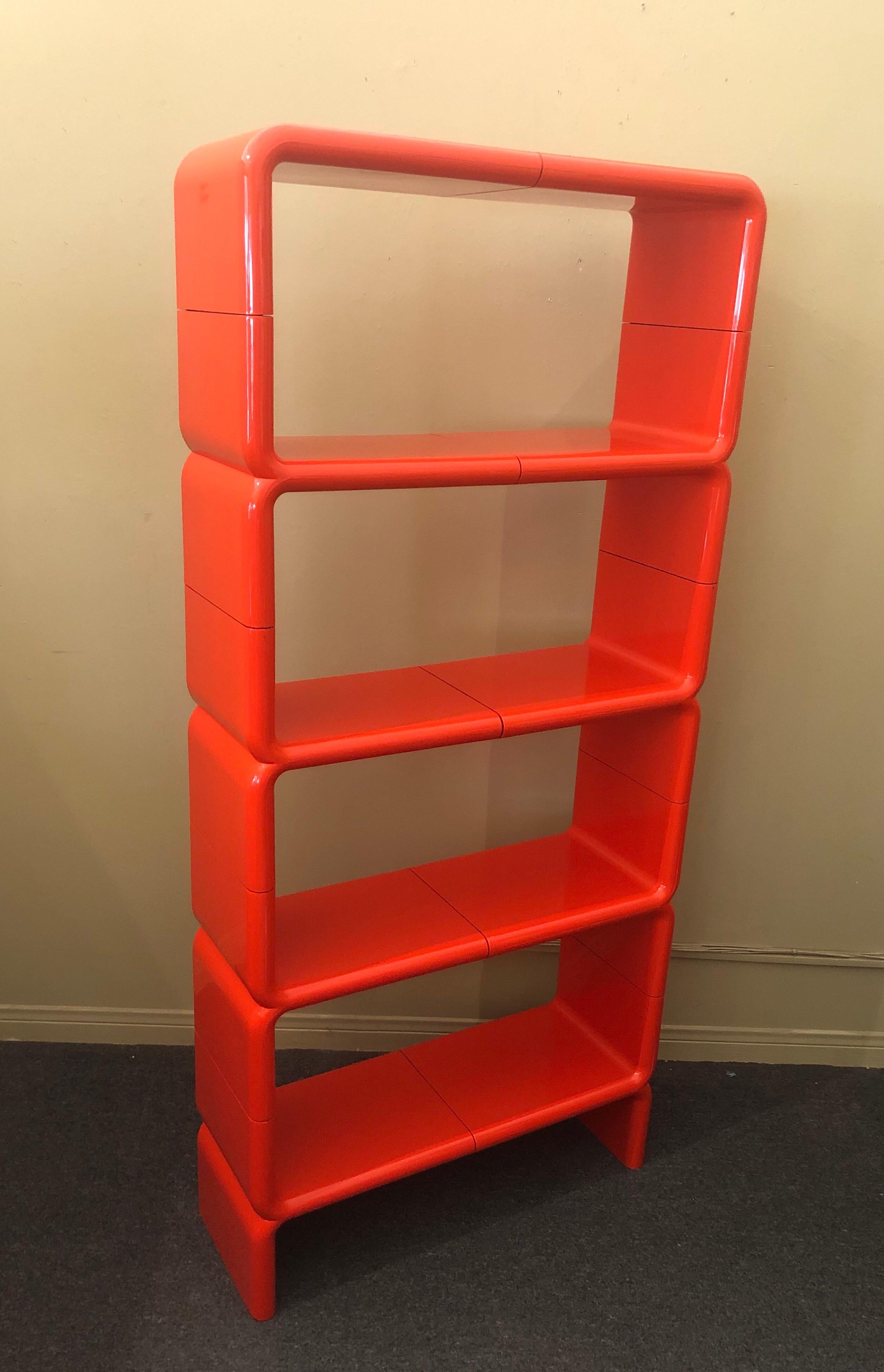 Super cool MCM orange, plastic, backless modular shelving system / bookcase by Kay Leroy Ruggles for Directional Furniture, circa 1970s. This Space Age 10 piece system, known as 