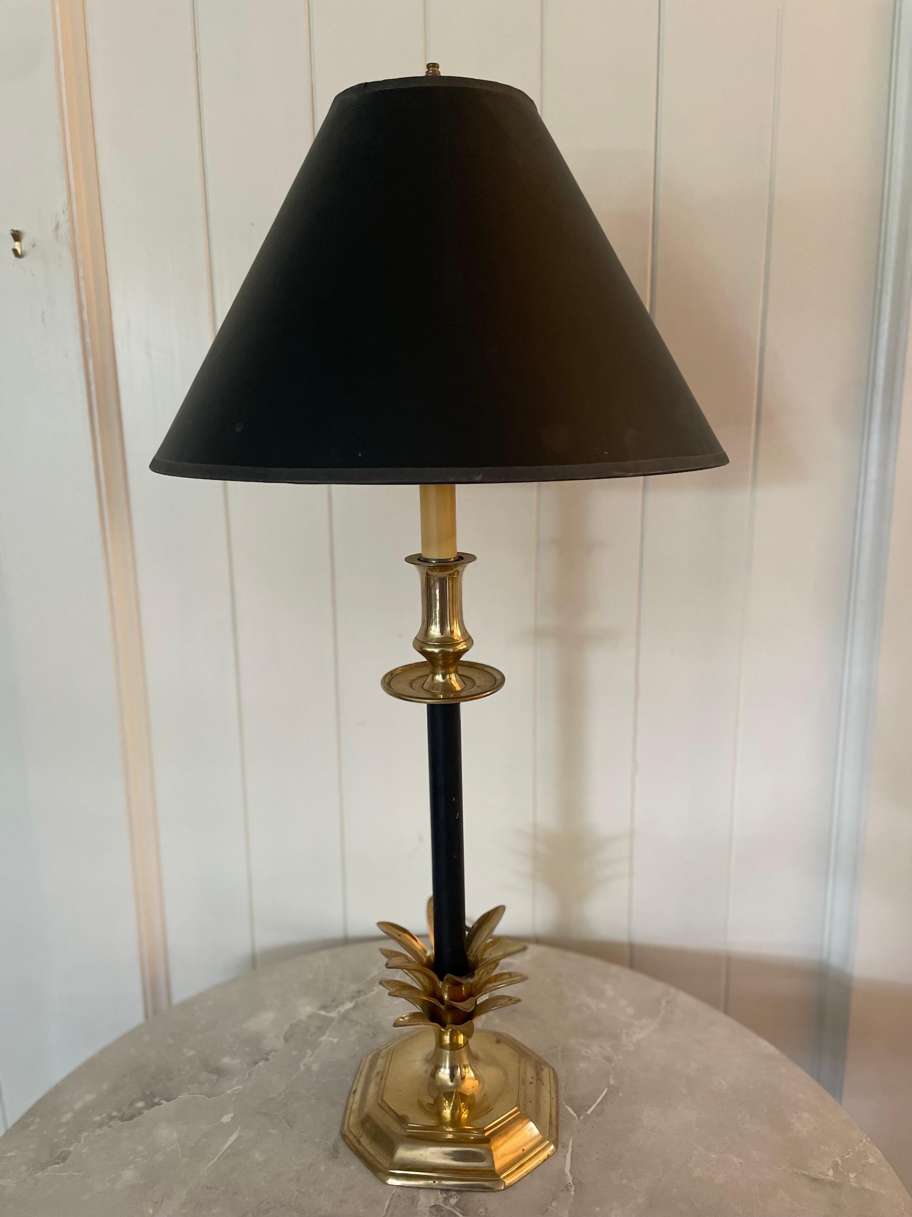 Vintage Frederick Cooper style brass lamp with black post. Original shade in matte black with gold interior. 

Great vintage condition. Shade is in free of any dents, bends, or burns, but there is one small crack in back as shown in pictures. 

Lamp